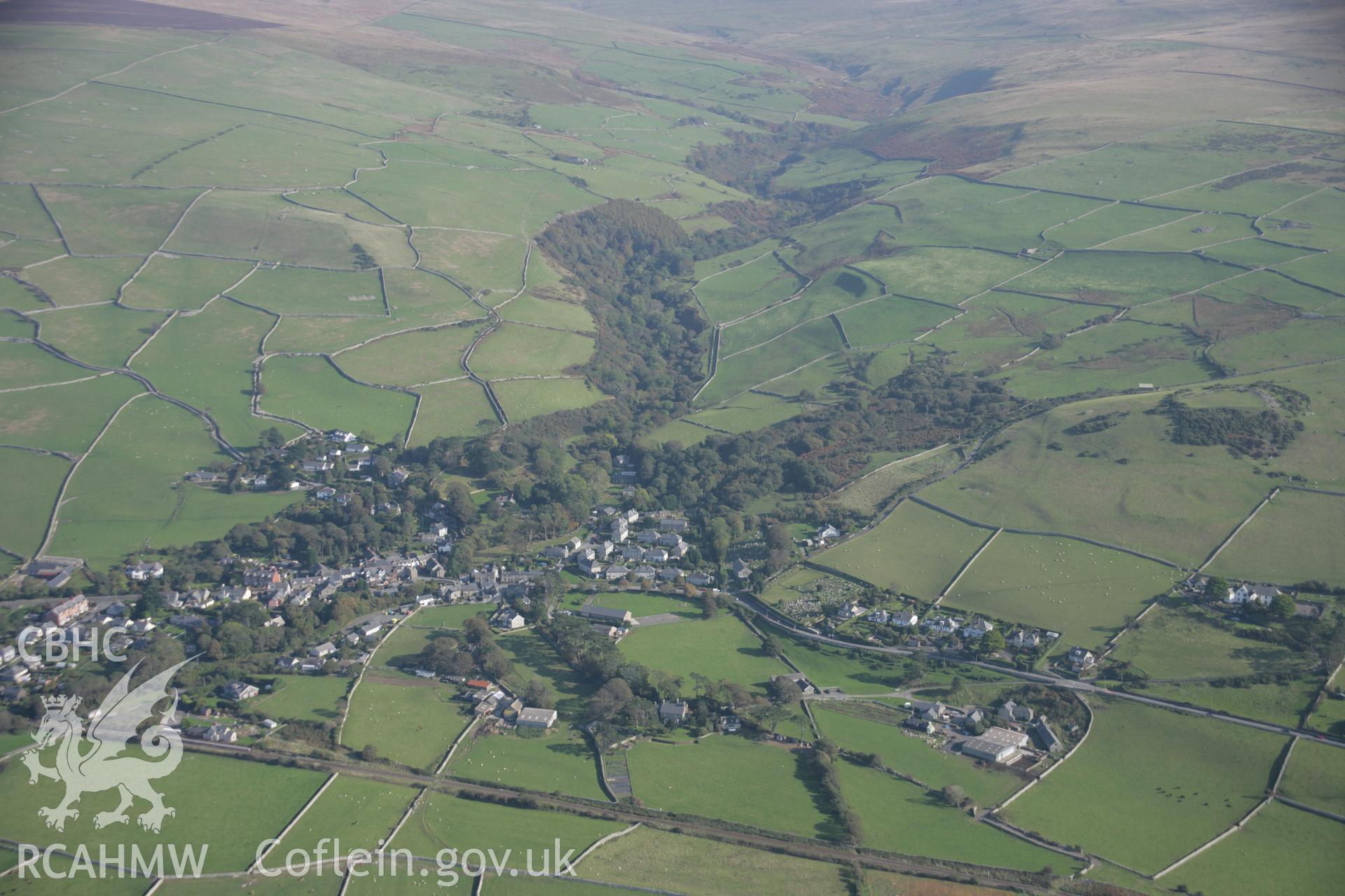 RCAHMW colour oblique aerial photograph of Llwyngwril, village, viewed from the west. Taken on 17 October 2005 by Toby Driver