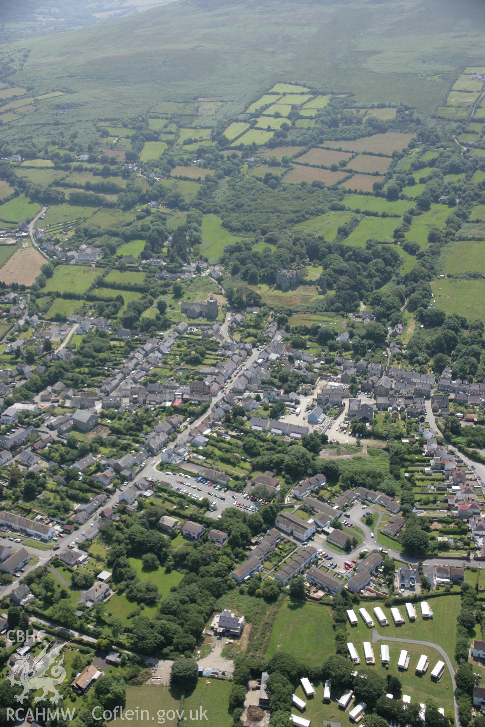 RCAHMW colour oblique aerial photograph of medieval borough of Newport, Pembrokeshire, in general view from the north-west. Taken on 11 July 2005 by Toby Driver