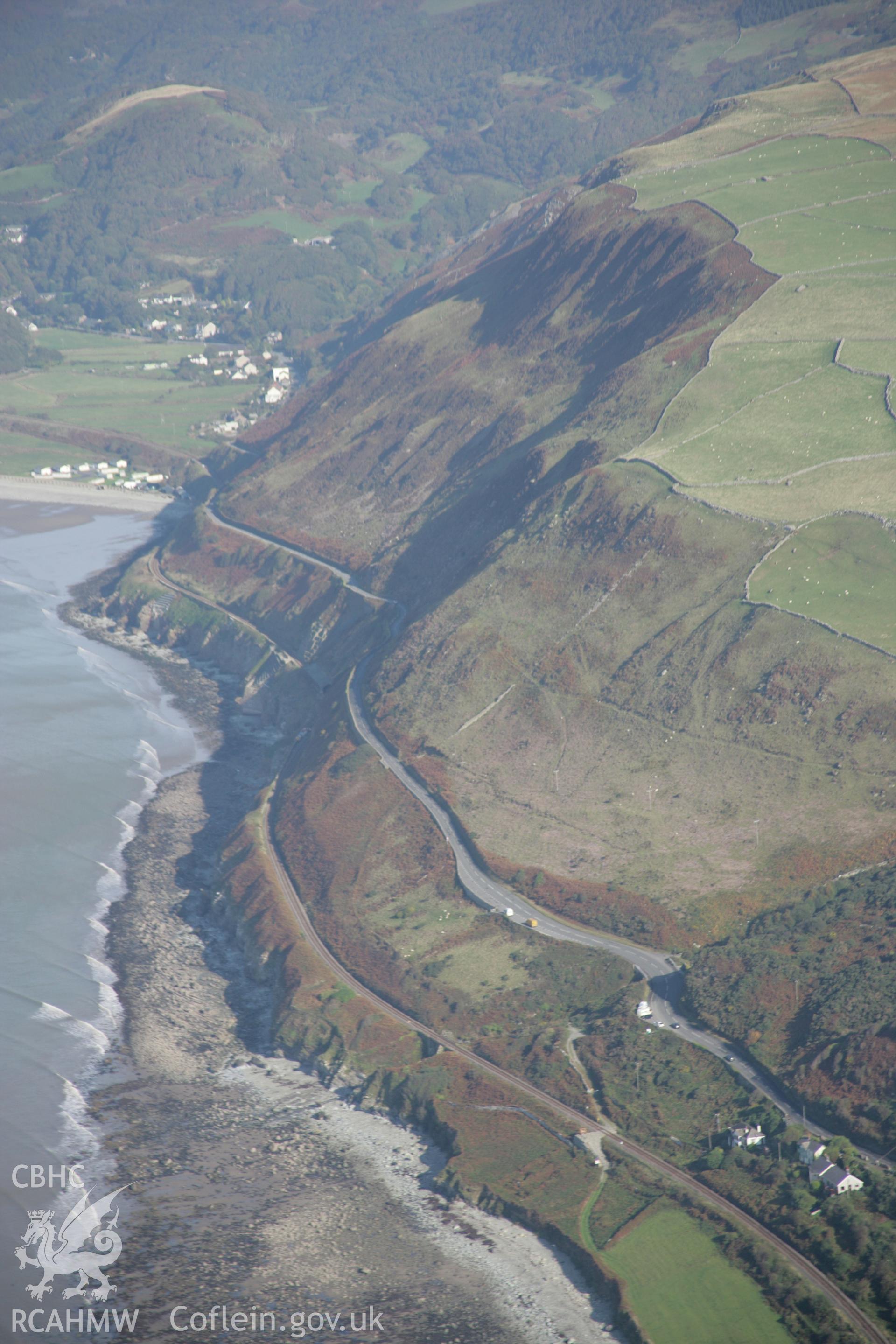 RCAHMW colour oblique aerial photograph of Cambrian Coast railway with engineering along coastal cliffs, viewed from the north-east. Taken on 17 October 2005 by Toby Driver
