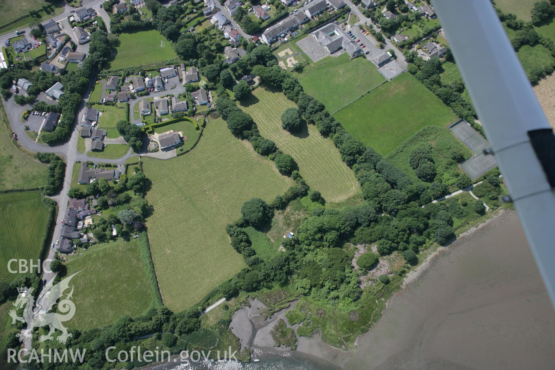 RCAHMW colour oblique aerial photograph of showing ringwork of Old Castle, Newport, viewed from the north-east. Taken on 11 July 2005 by Toby Driver