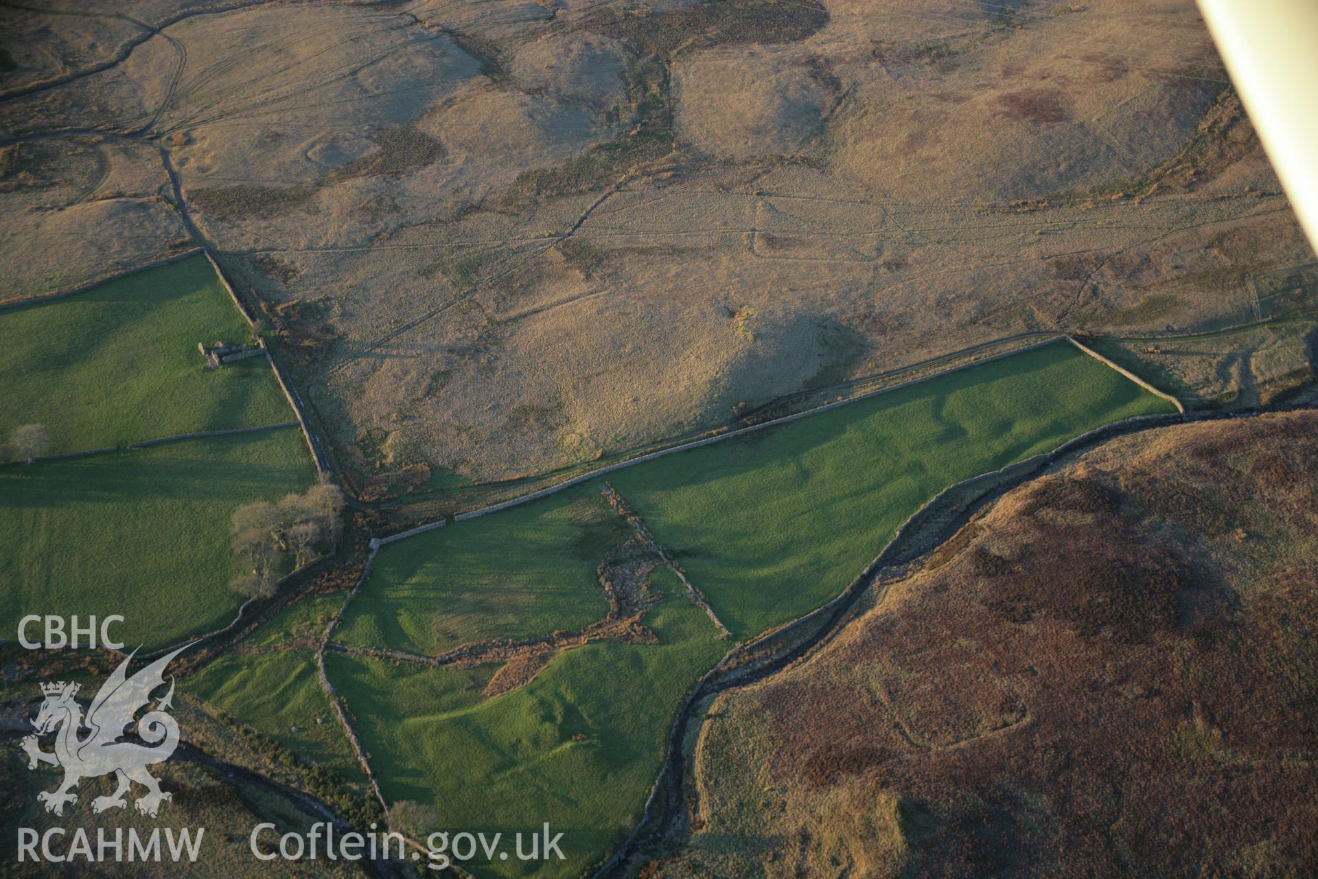 RCAHMW colour oblique aerial photograph of Roman practice camps, Dolddinas I, III, IV and V viewed from the south-east. Taken on 21 November 2005 by Toby Driver