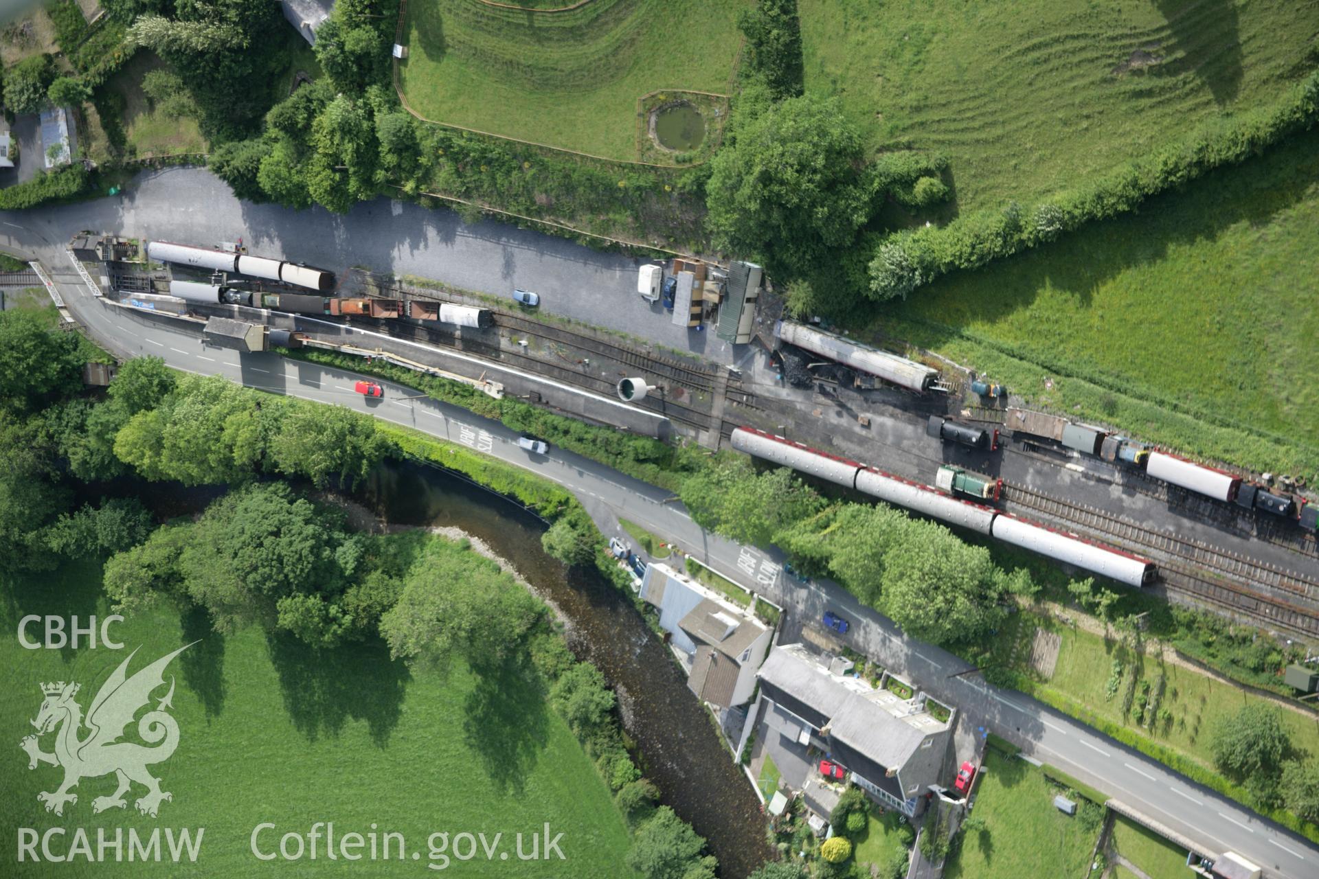 RCAHMW colour oblique aerial photograph of Bronwydd Arms Railway Station, Carmarthen and Cardigan Railway, from the south. Taken on 09 June 2005 by Toby Driver