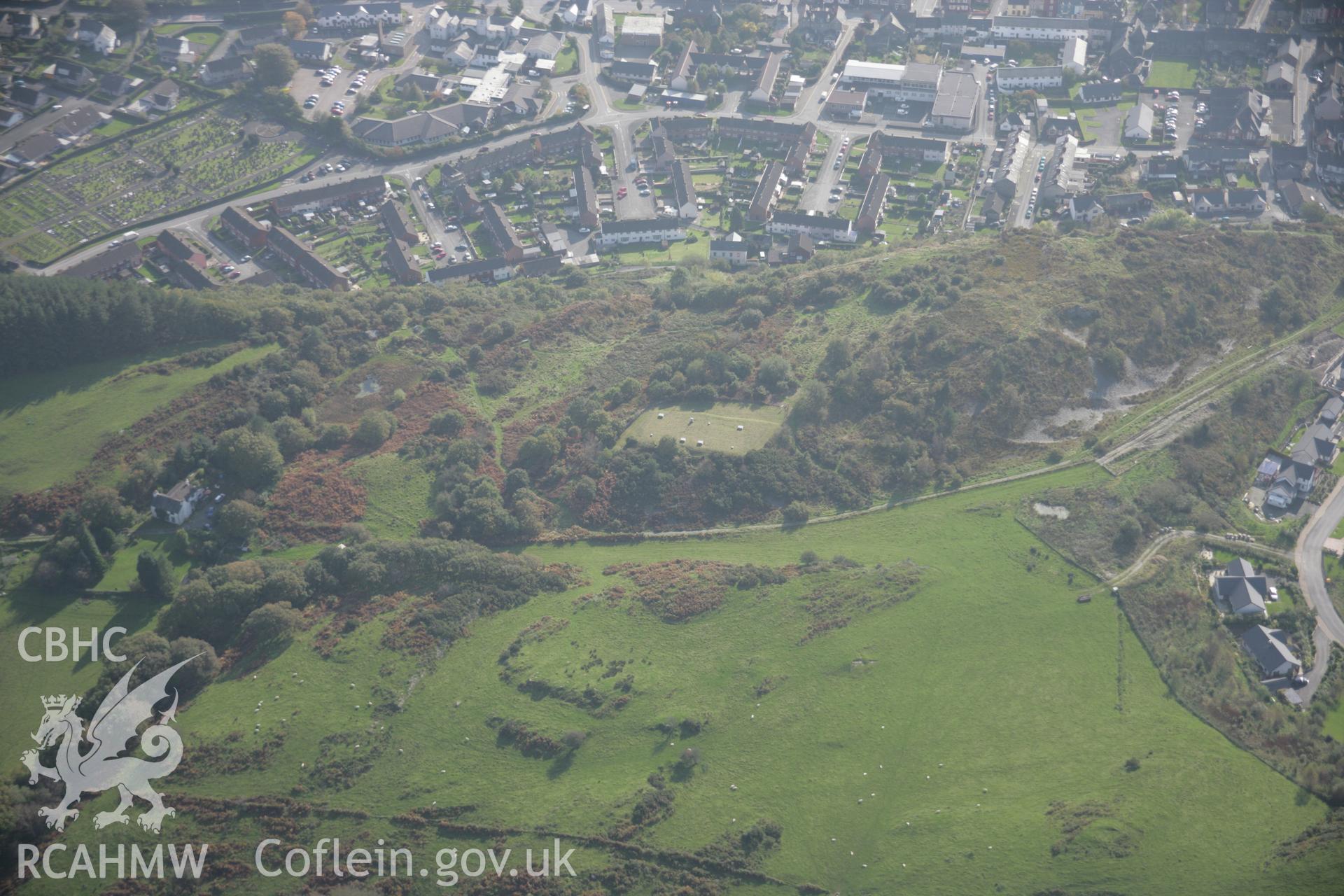 RCAHMW colour oblique aerial photograph showing view of Pistyll Gwyn Medicinal Well and hill top, Machynlleth, viewed from the north. Taken on 17 October 2005 by Toby Driver