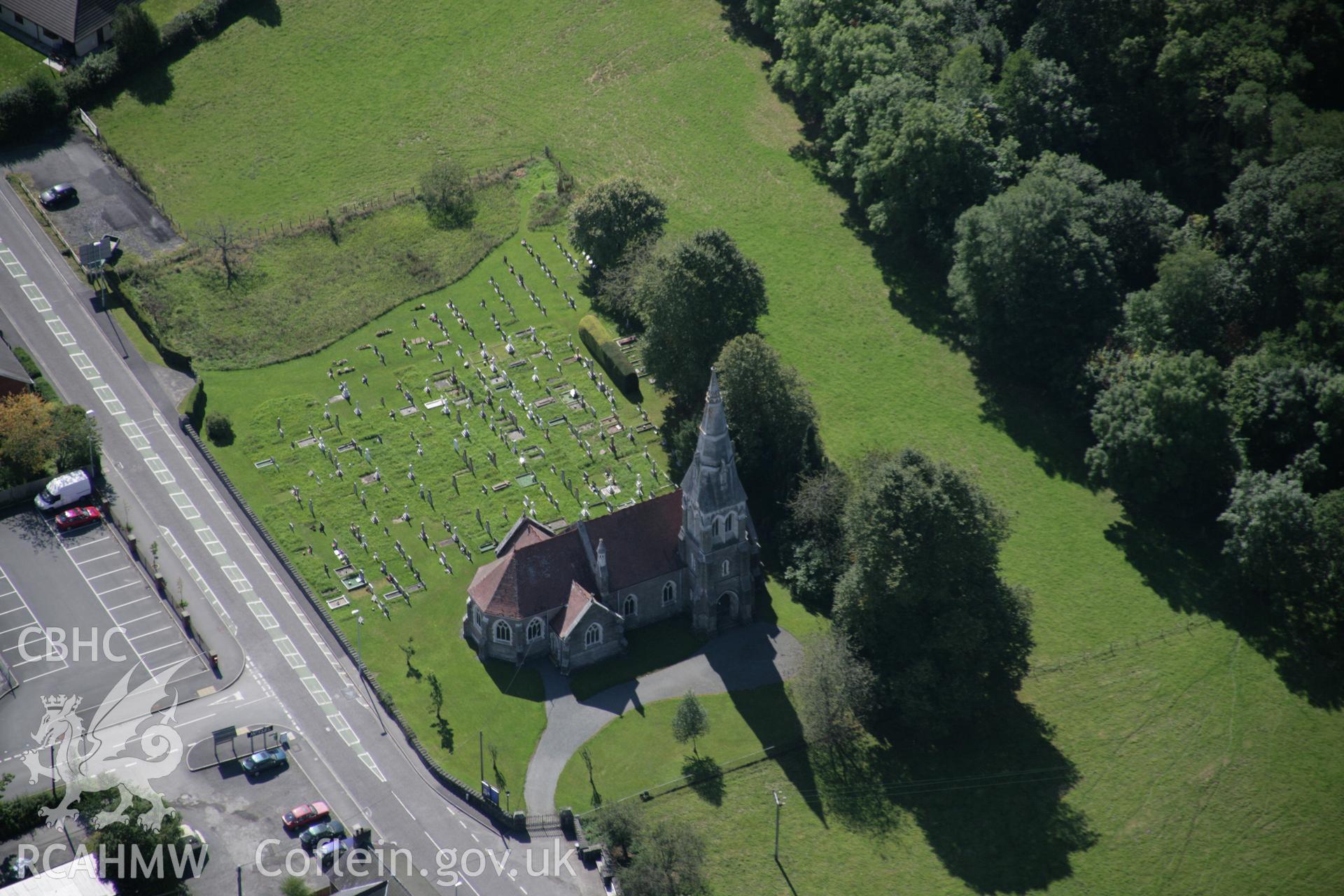 RCAHMW colour oblique aerial photograph of All Saints Church, Newbridge on Wye viewed from the north-east. Taken on 02 September 2005 by Toby Driver