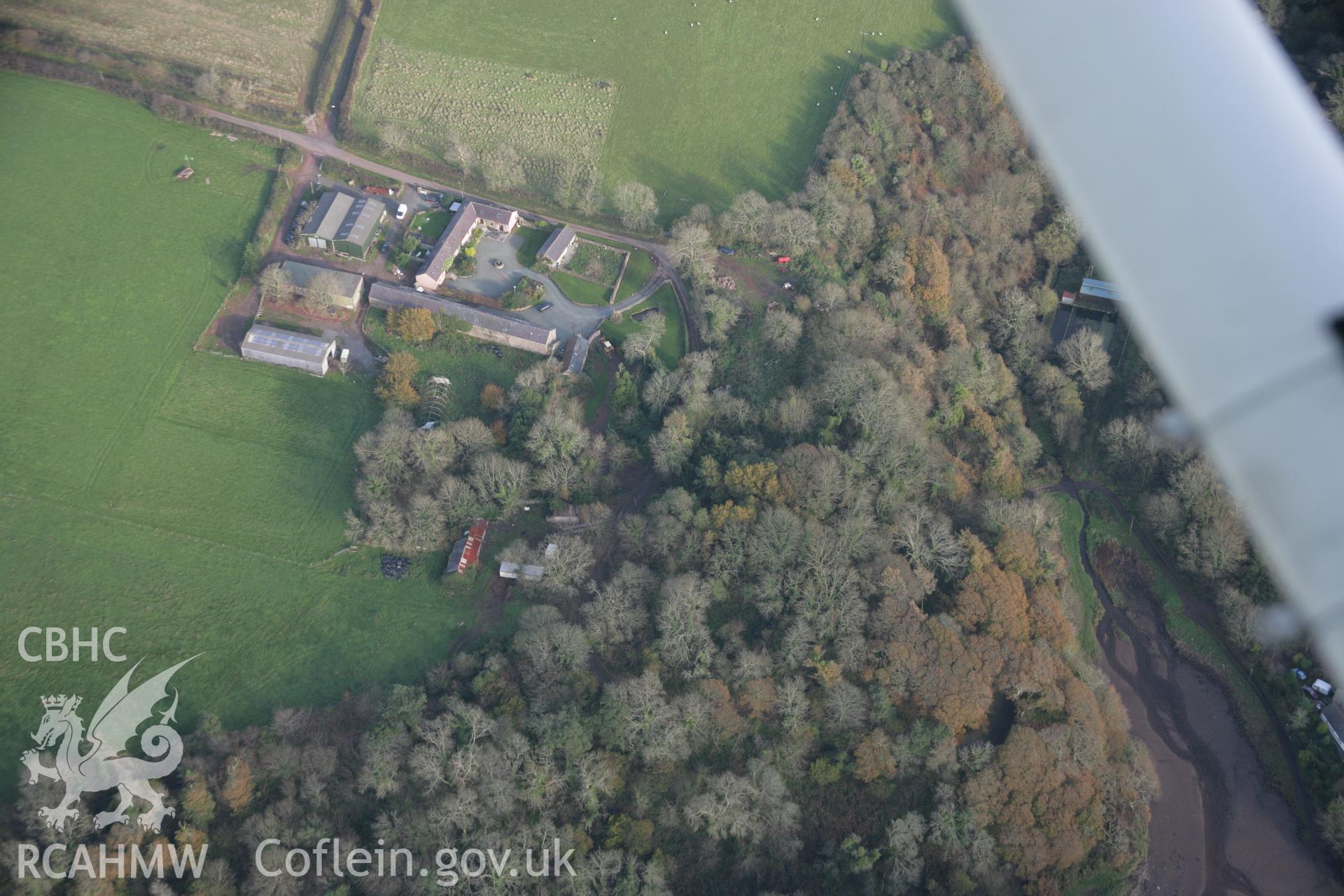 RCAHMW colour oblique photograph of Castle Pill (wooded), view from north-west. Taken by Toby Driver on 17/11/2005.