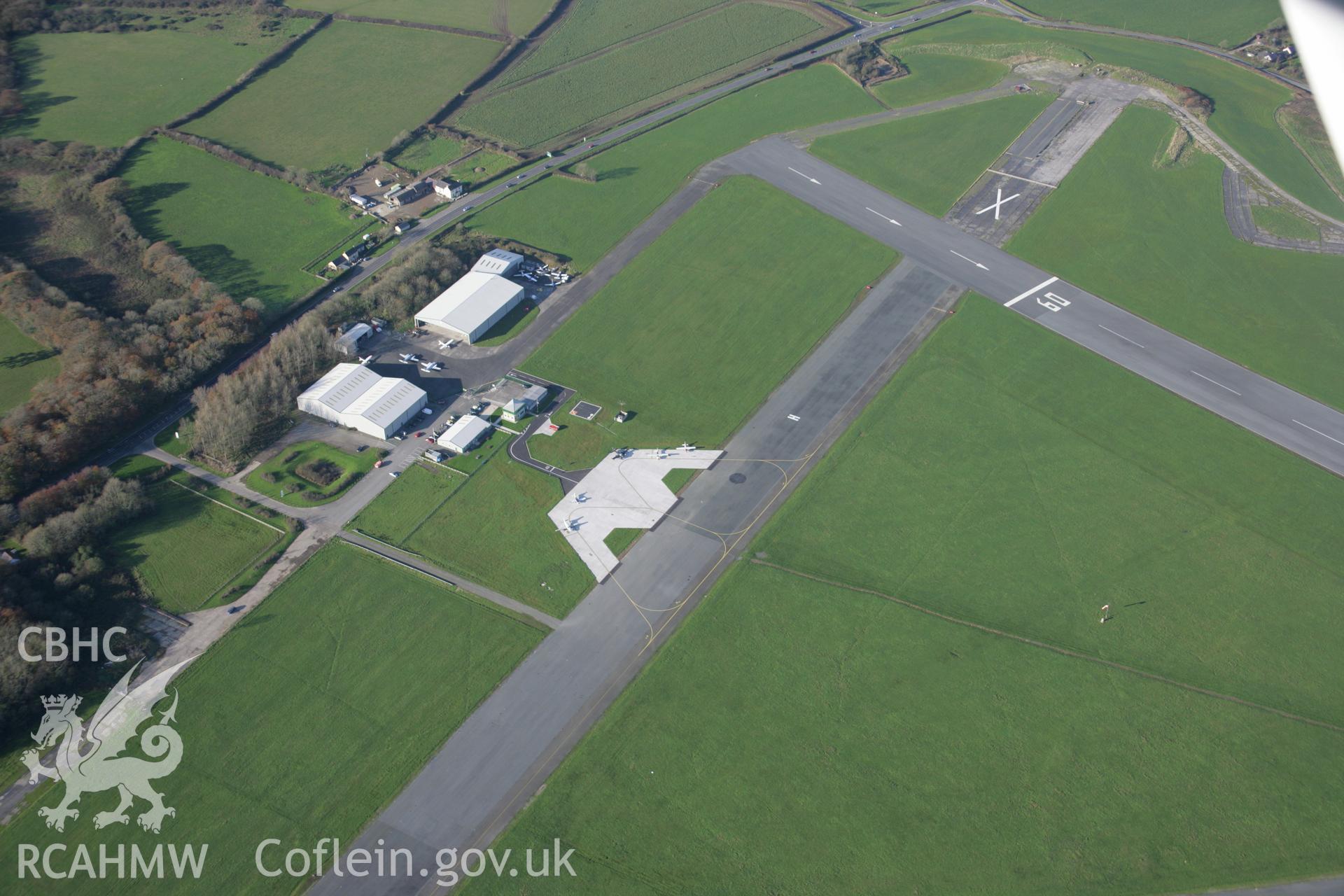 RCAHMW colour oblique aerial photograph of Haverfordwest Airfield (Withybush) with general view of hangars and control tower, from the south - east. Taken on 19 November 2005 by Toby Driver