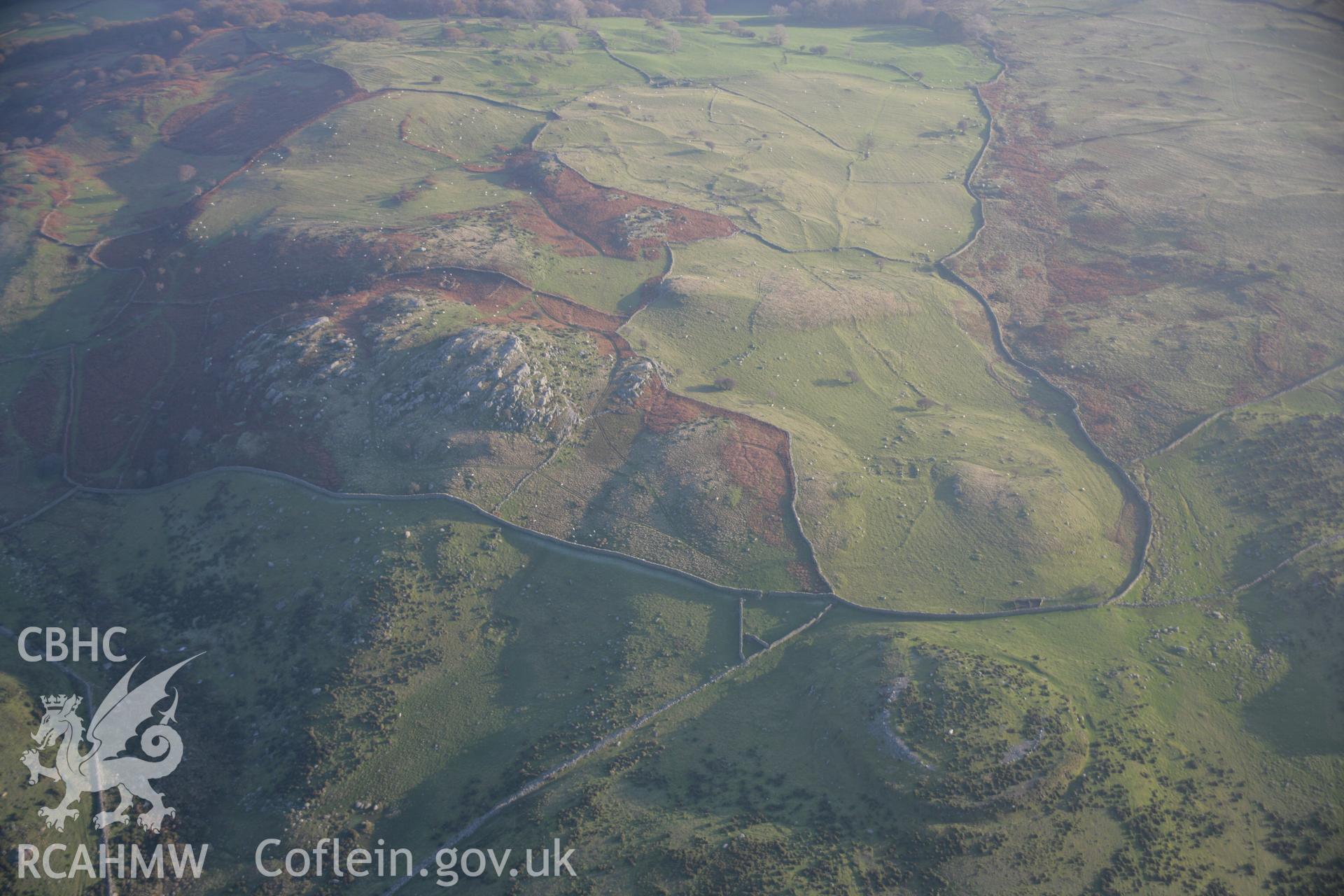 RCAHMW colour oblique aerial photograph of Caer Bach Hillfort from the north-west. Taken on 21 November 2005 by Toby Driver