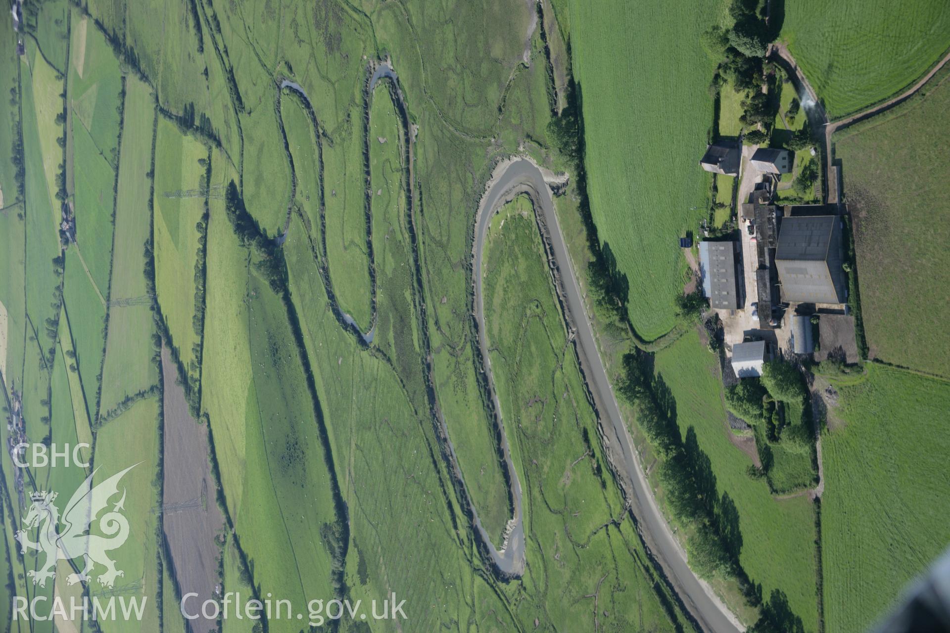 RCAHMW colour oblique aerial photograph of St Teilo's Church, Llandilo Abercowin. A scenic view with river meanders to the north. Taken on 09 June 2005 by Toby Driver