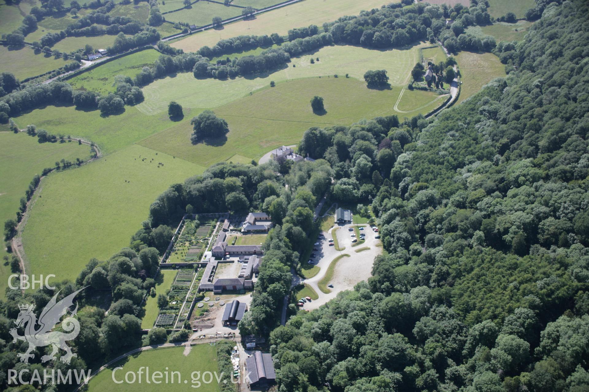 RCAHMW colour oblique aerial photograph of the garden at Llanerchaeronalso showing the house, from the north-east. Taken on 23 June 2005 by Toby Driver