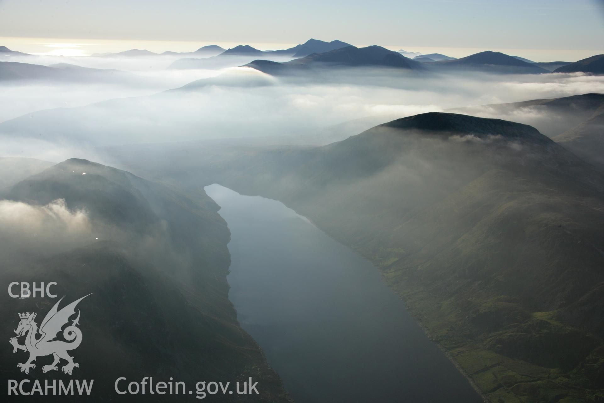 RCAHMW colour oblique aerial photograph of Llyn Cowlyd shown in Non-archaeological mountain landscape with mist, from south-east. Dust specks are visible from the digital sensor. Taken on 21 November 2005 by Toby Driver
