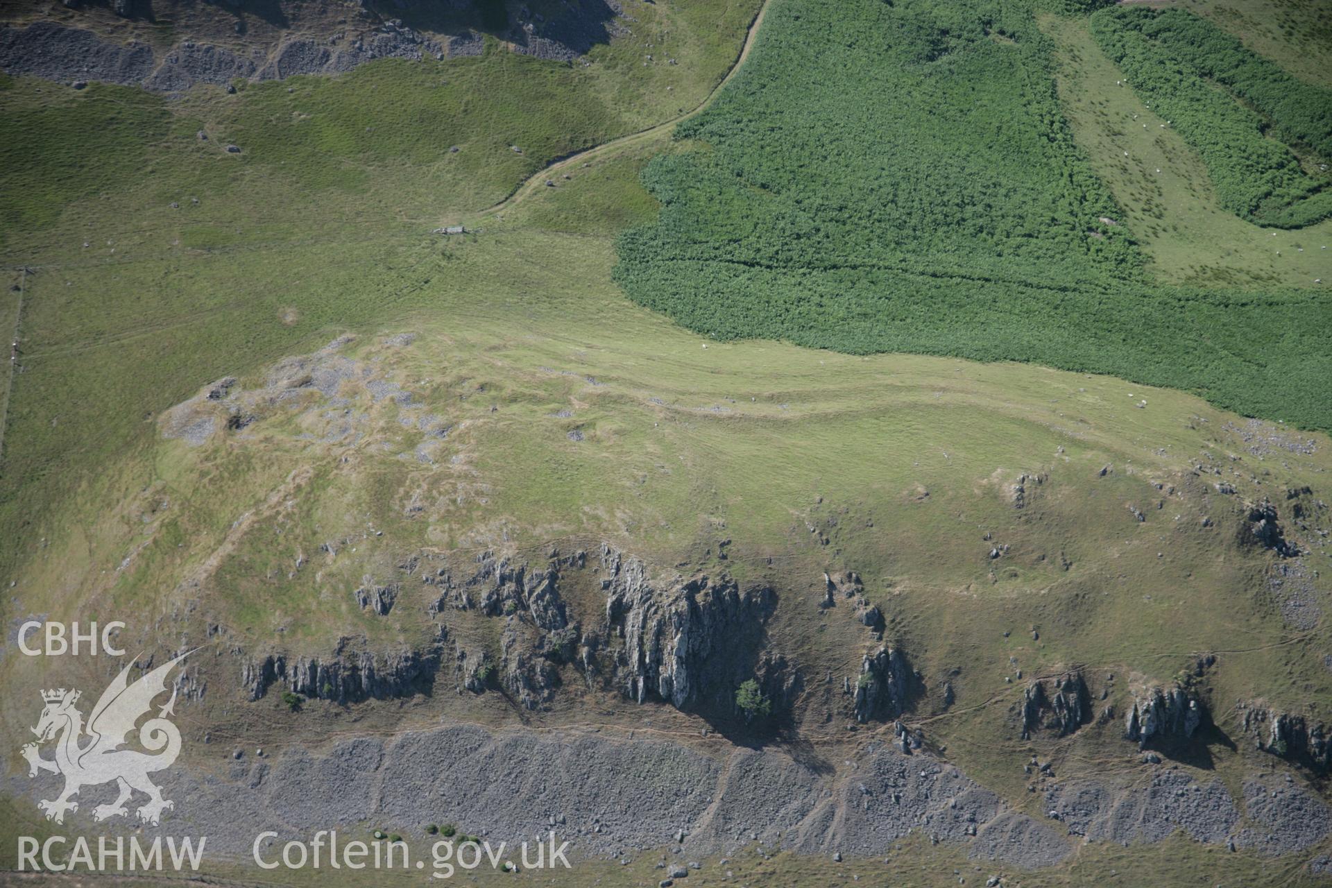 RCAHMW digital colour oblique photograph of the defended enclosure at Llandegly Rocks viewed from the east. Taken on 21/07/2005 by T.G. Driver.