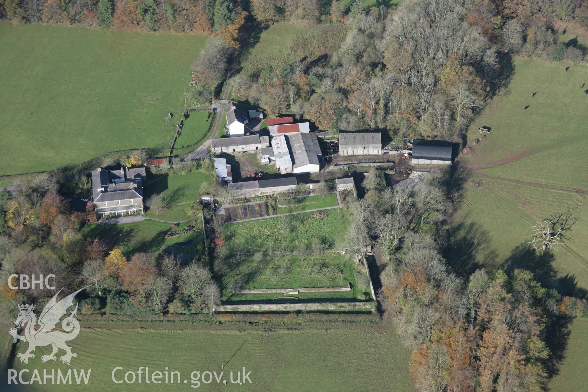RCAHMW colour oblique photograph of Carreg Cennen, house and walled garden, view from south-east. Taken by Toby Driver on 17/11/2005.