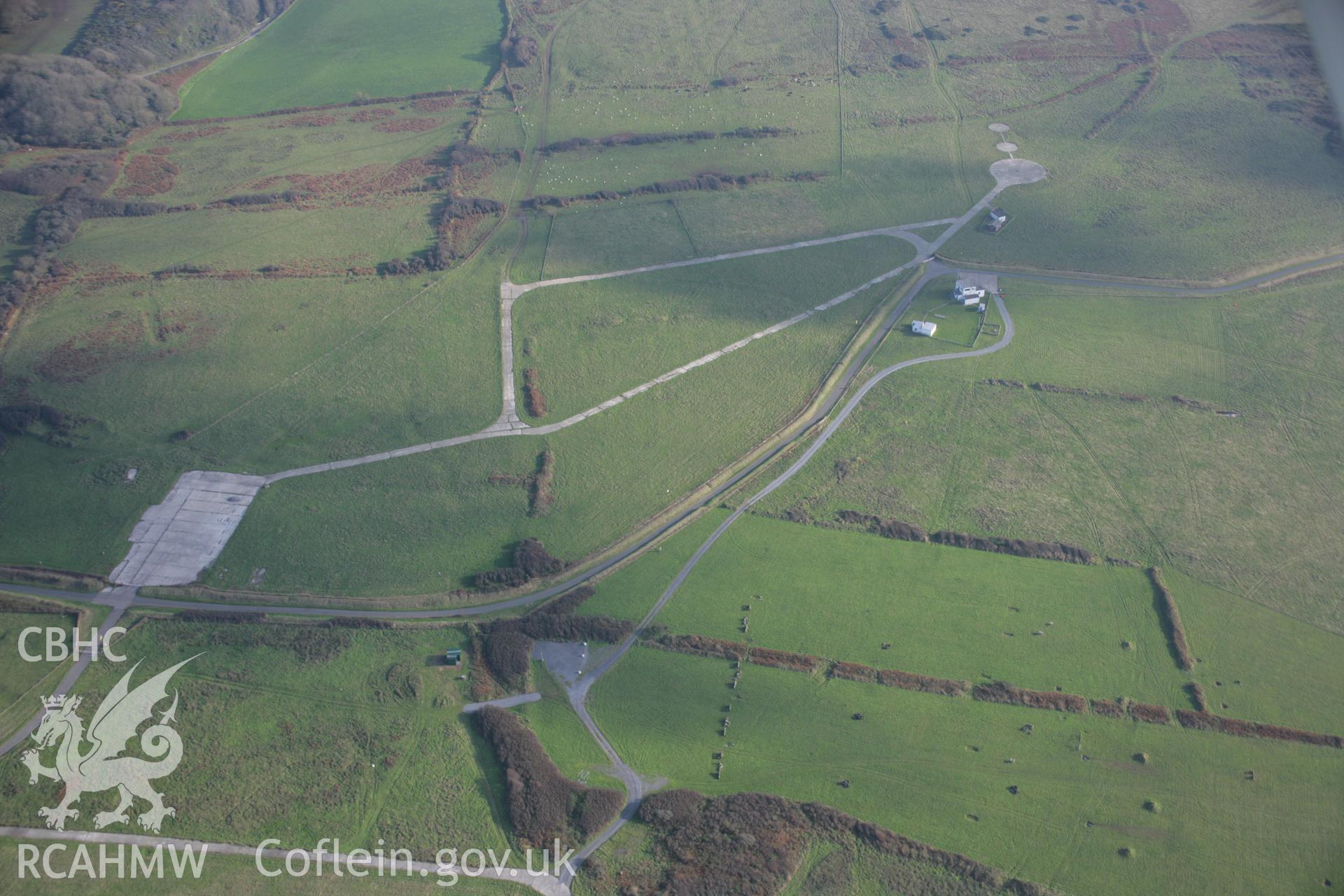 RCAHMW colour oblique aerial photograph of Castlemartin Training Area looking east and showing military roads and installations near Newton. Taken on 19 November 2005 by Toby Driver