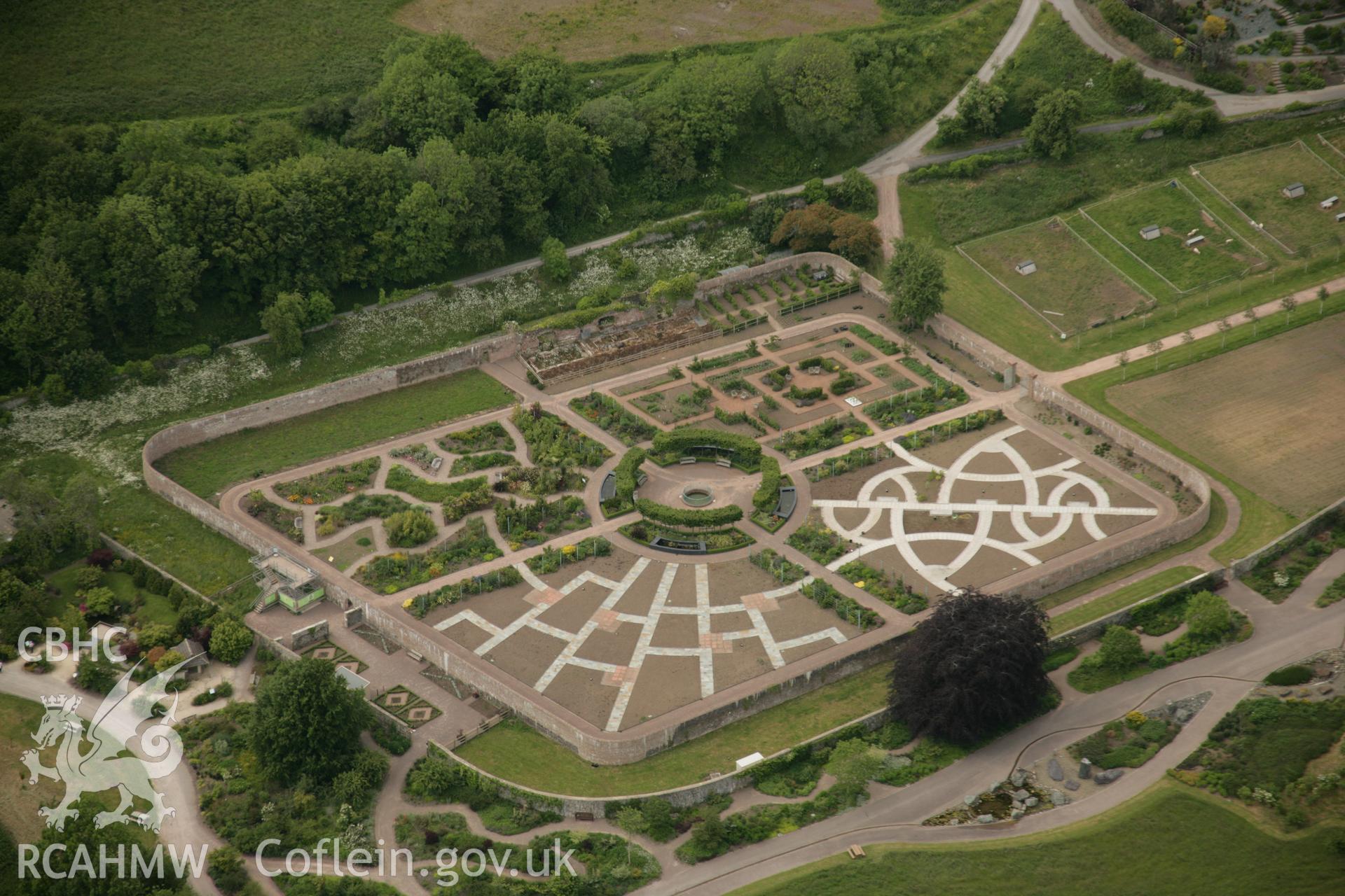 RCAHMW colour oblique aerial photograph of Middleton Hall Park, now the National Botanic Garden of Wales, showing walled garden from the south. Taken on 09 June 2005 by Toby Driver