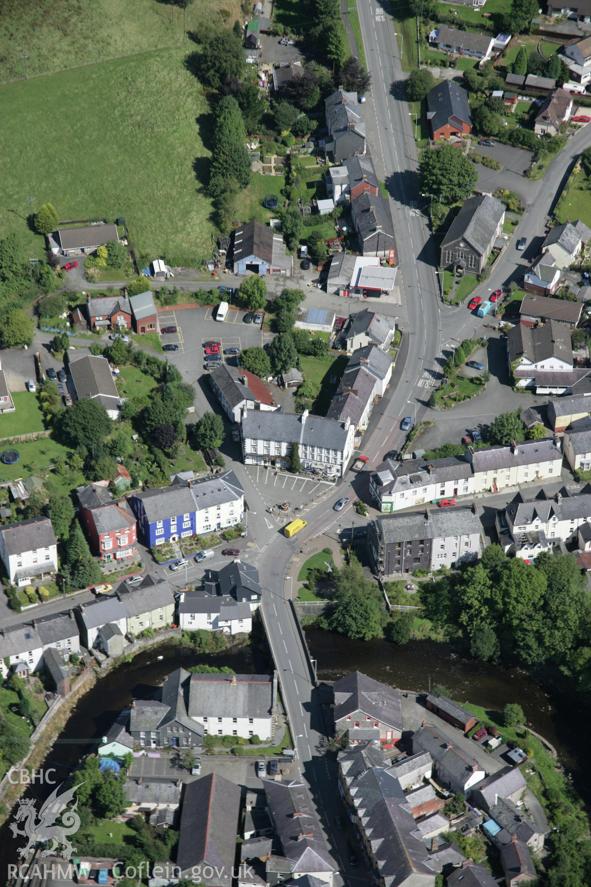RCAHMW colour oblique aerial photograph of Llanwrtyd Wells town centre and bridge viewed from south-west Taken on 02 September 2005 by Toby Driver
