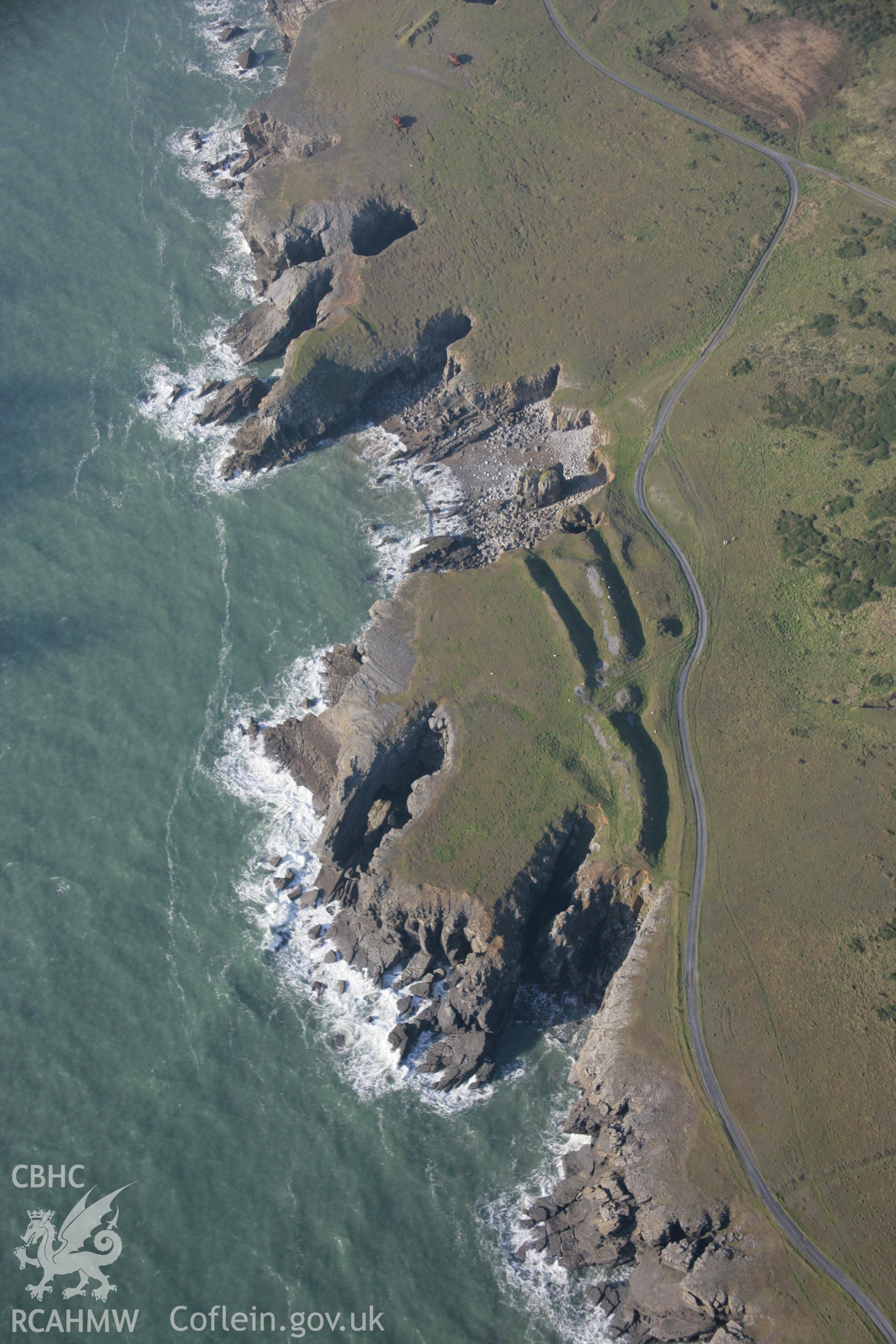 RCAHMW colour oblique aerial photograph of promontory fort at Linney Head Camp, Castlemartin, viewed from the east. Taken on 19 November 2005 by Toby Driver
