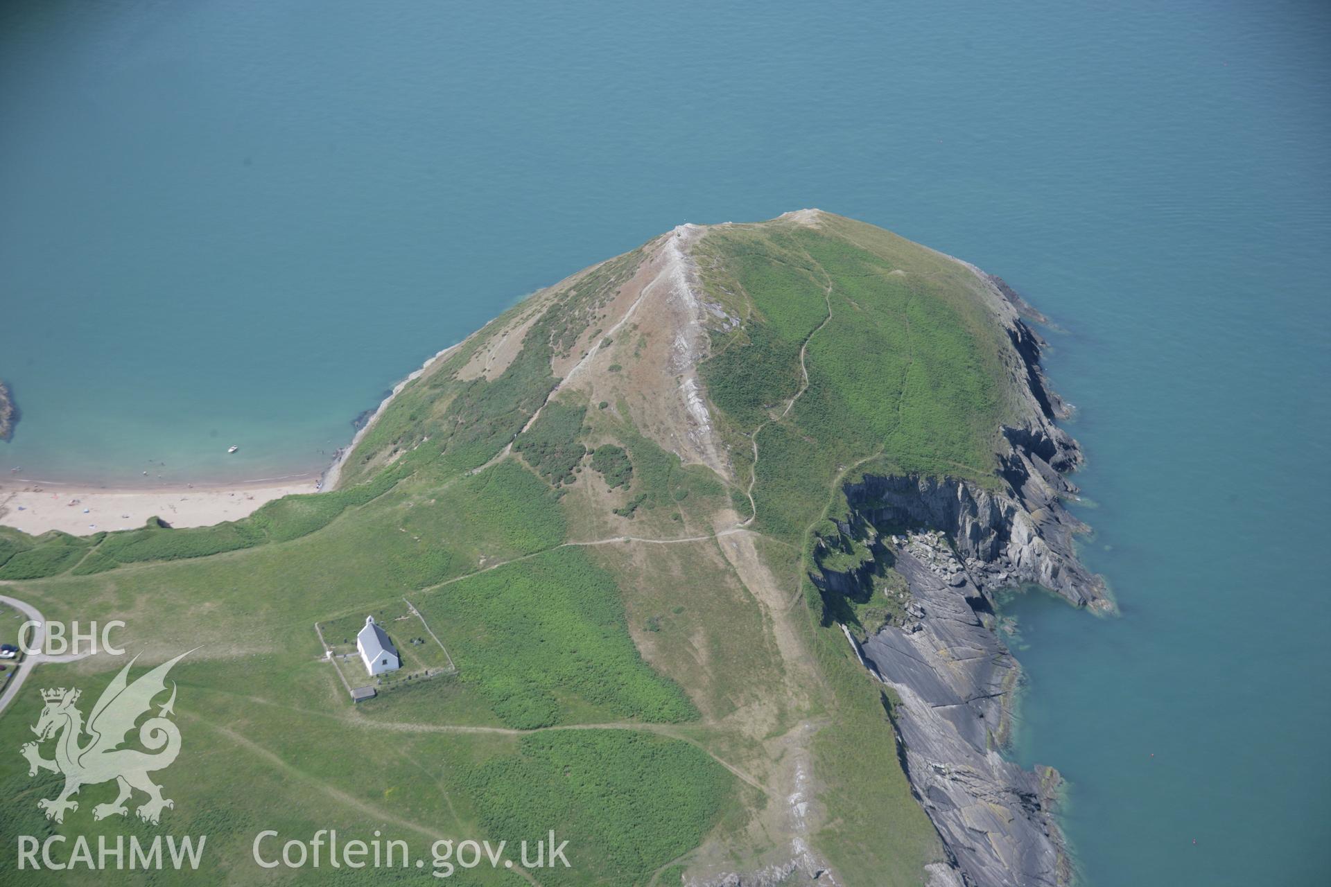 RCAHMW colour oblique aerial photograph of Foel y Mwnt from the east showing the church and parching of the fields. Taken on 11 July 2005 by Toby Driver