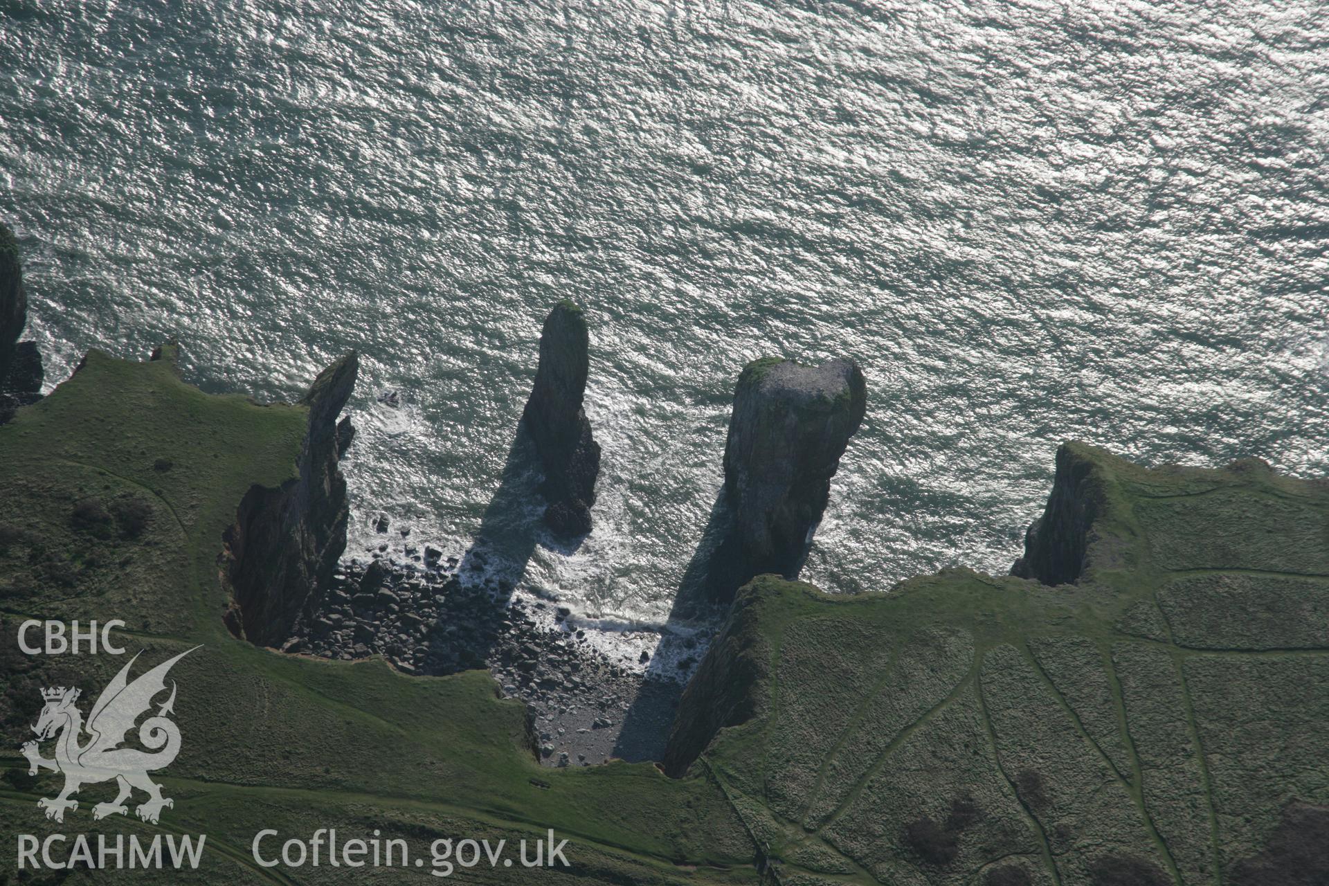 RCAHMW colour oblique aerial photograph of the Green Bridge (of Wales) and Elegug Stacks from the north. Taken on 19 November 2005 by Toby Driver