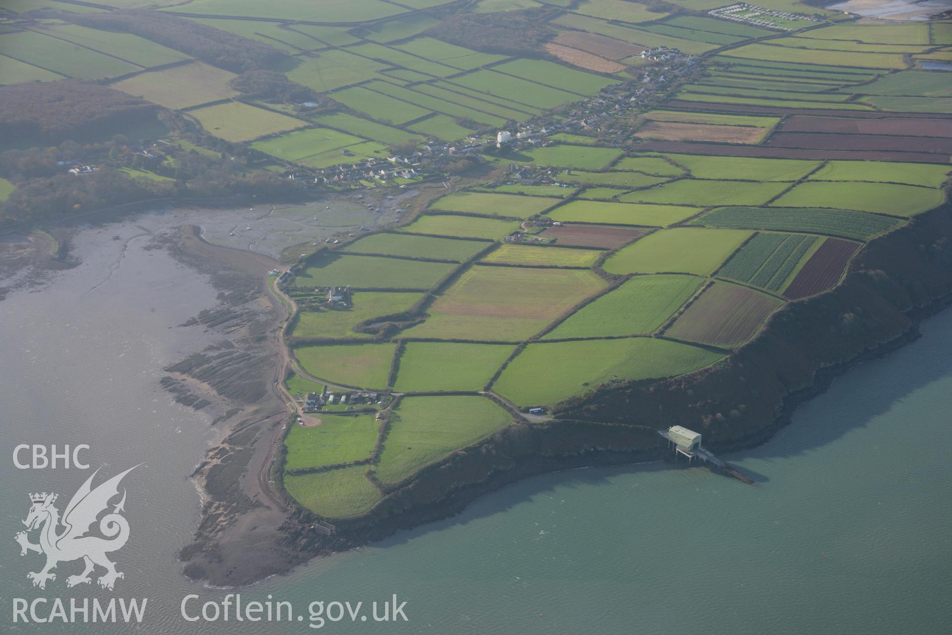 RCAHMW colour oblique aerial photograph of Angle with the village and lifeboat station visible. Viewed from the north-east. Taken on 19 November 2005 by Toby Driver