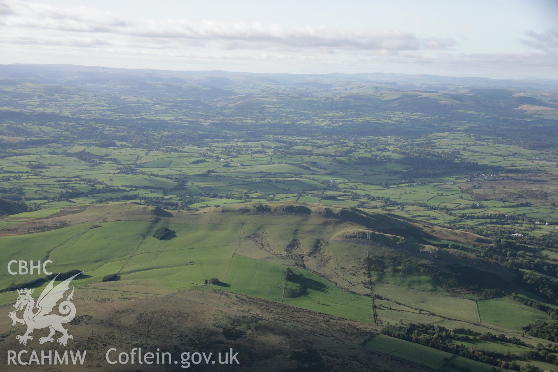 RCAHMW colour oblique aerial photograph of Llandegley Rocks West Enclosure showing hillfort and defended enclosure wide landscape view from the south-east. Taken on 13 October 2005 by Toby Driver