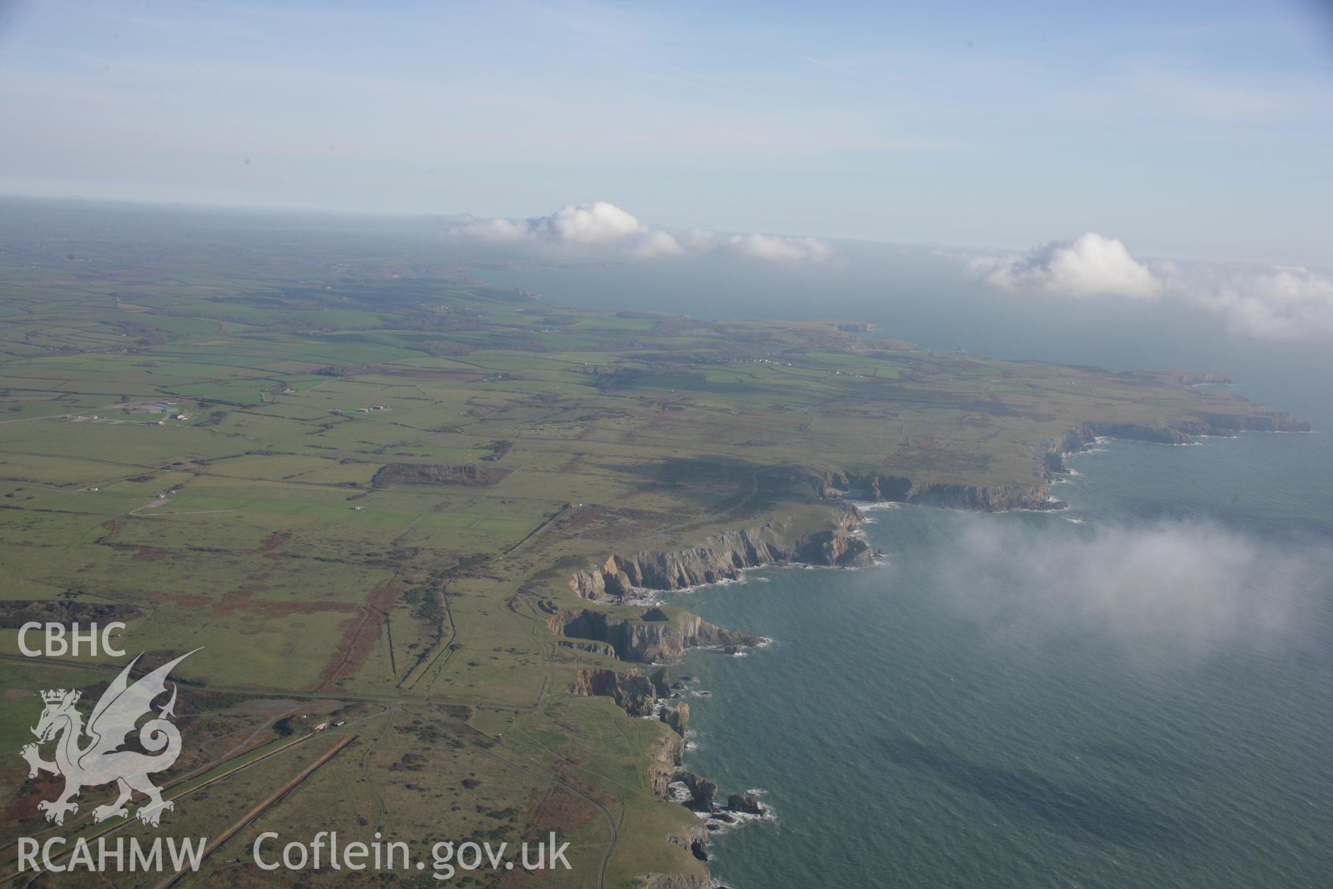 RCAHMW colour oblique aerial photograph of Flimston Bay Camp, Castlemartin. A wide landscape view of the Castle martin training area. Taken on 19 November 2005 by Toby Driver