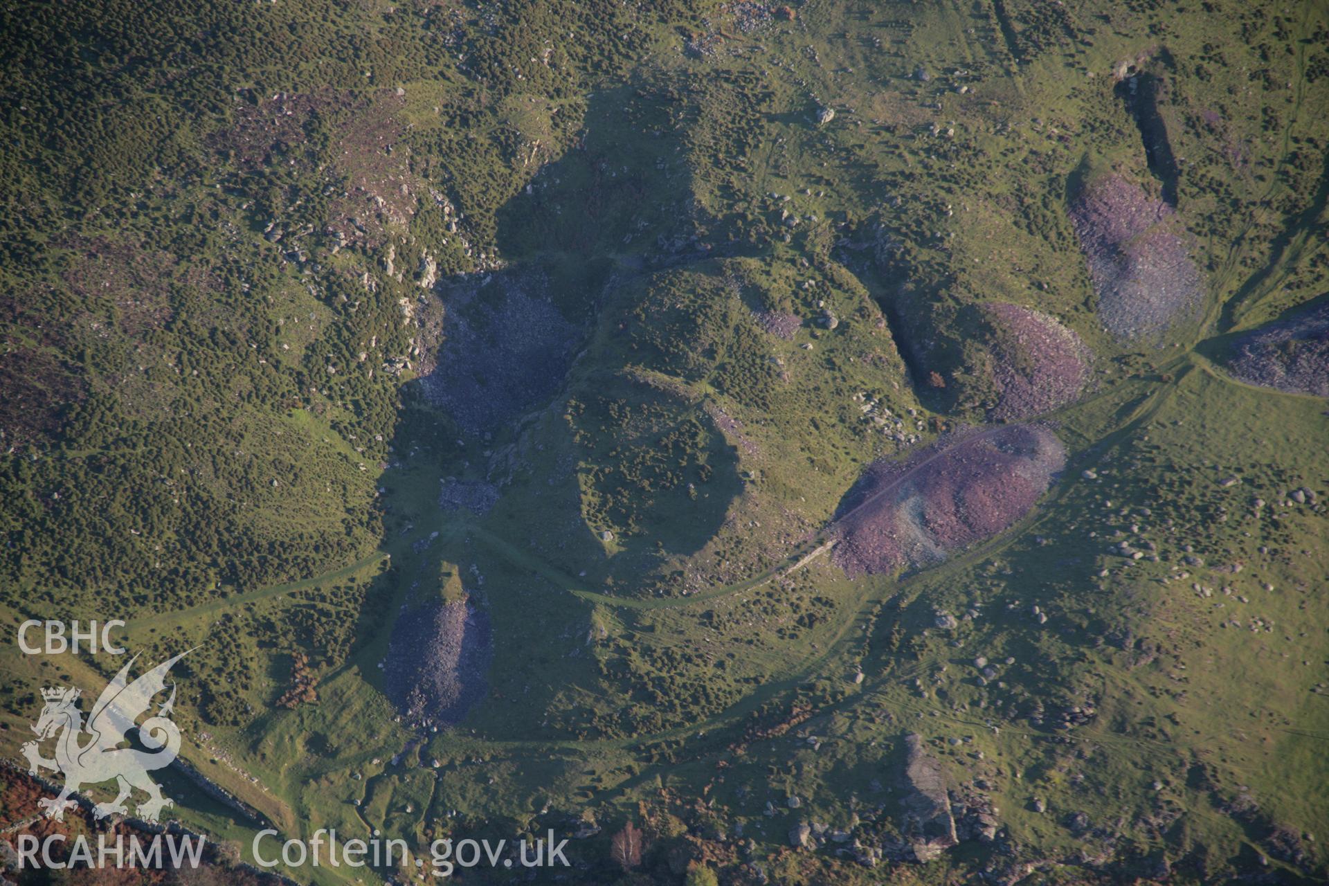 RCAHMW colour oblique aerial photograph of a fortified hut settlement above Rachub and slate tips, viewed from the north-west. Taken on 21 November 2005 by Toby Driver