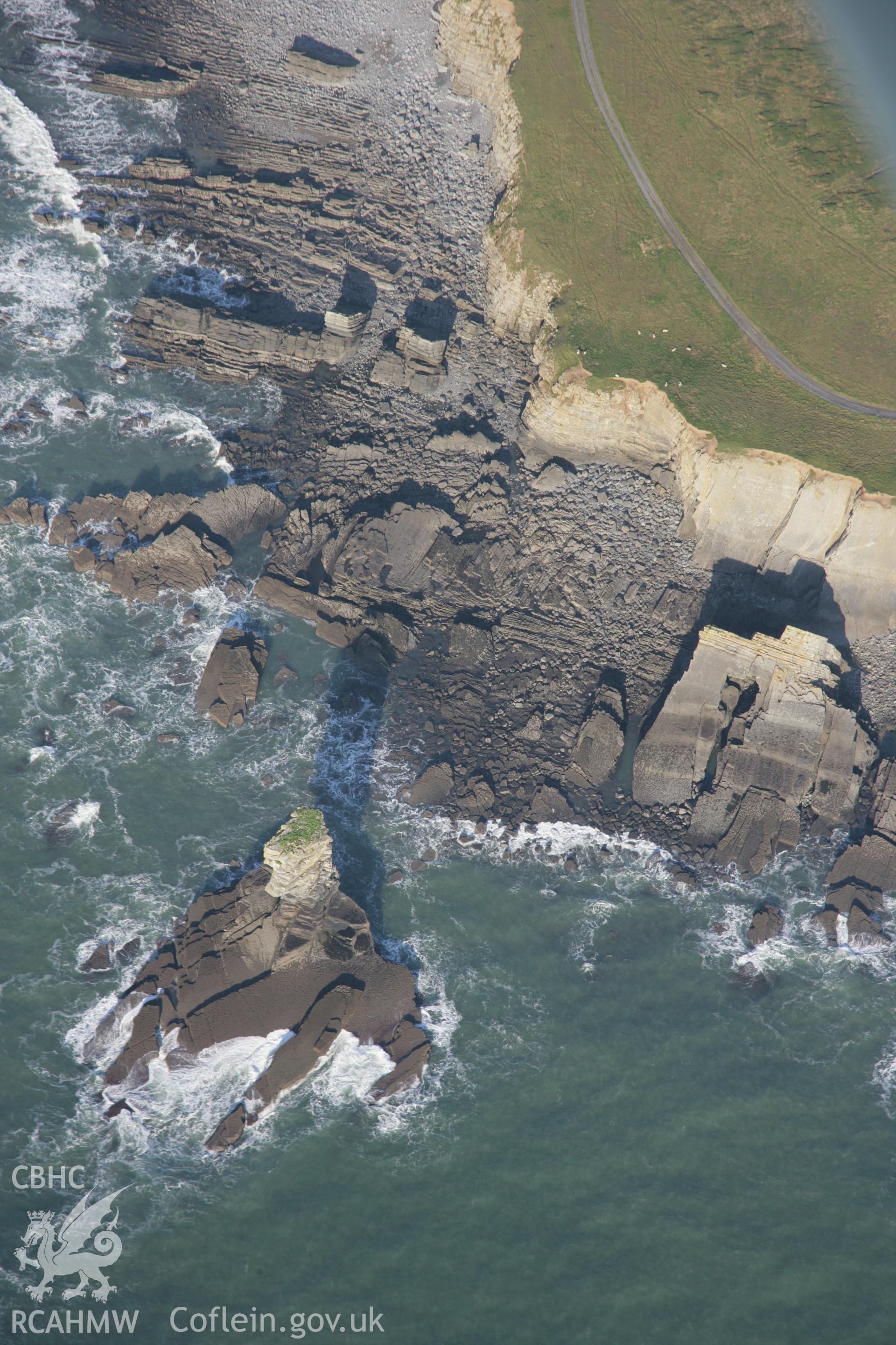 RCAHMW colour oblique aerial photograph of Castlemartin Training Area showing Pen-y-Holt Stack and the coastal landscape from the south. Taken on 19 November 2005 by Toby Driver