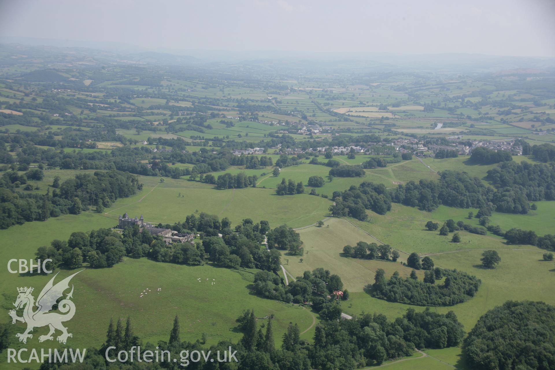 RCAHMW colour oblique aerial photograph of Newton House, (Dinefwr Castle), Llandeilo, showing wide view of parkland and excavations on Roman for, viewed from the west. Taken on 11 July 2005 by Toby Driver