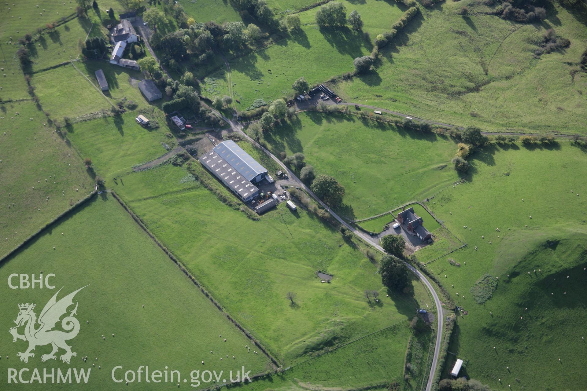 RCAHMW colour oblique aerial photograph of Cefnllys Castle Deer Park, Penybont, from the north-east showing field lynchets. Taken on 13 October 2005 by Toby Driver