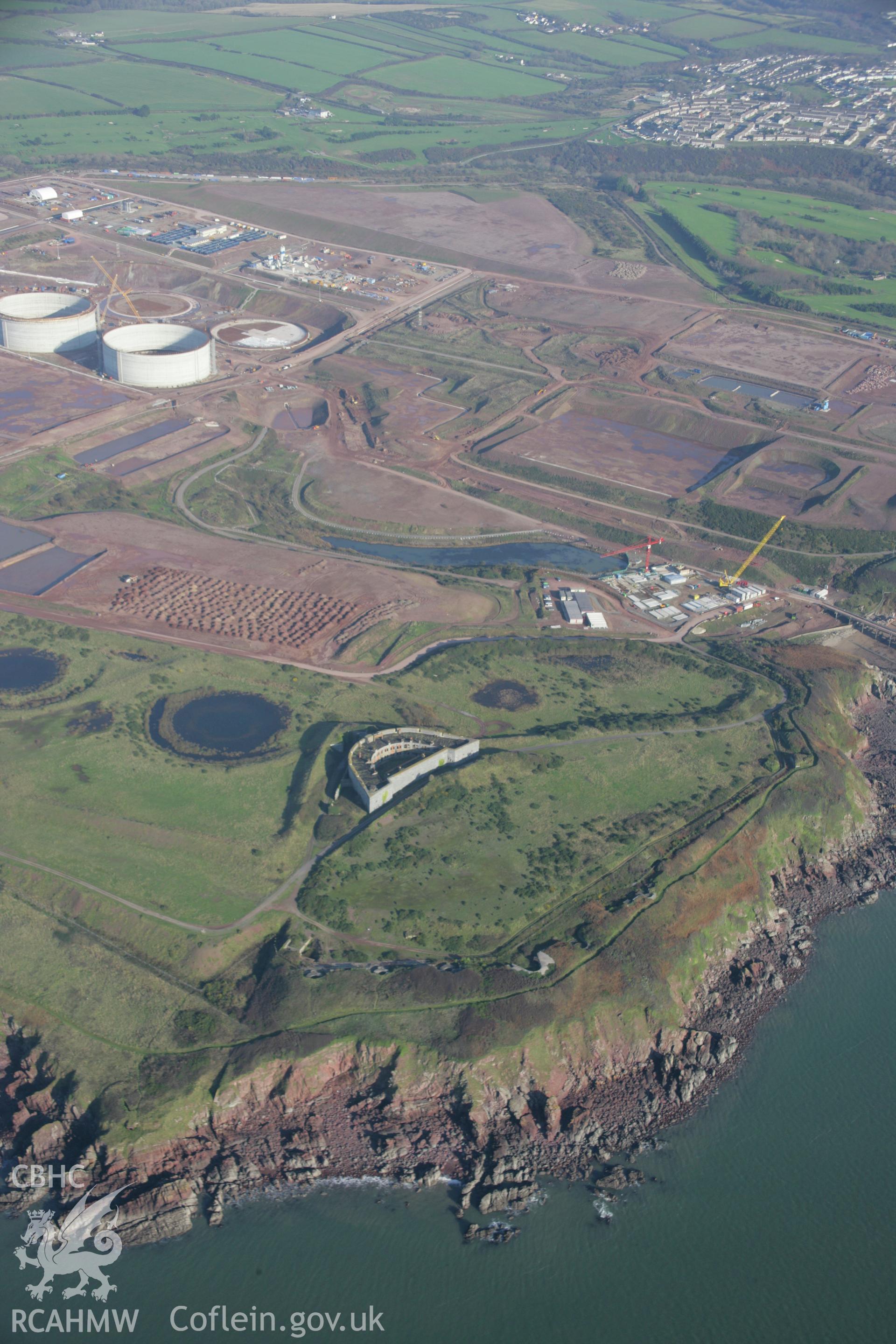RCAHMW colour oblique aerial photograph of South Hook Fort from the south-west showing construction of the liquified natural gas depot beyond. Taken on 19 November 2005 by Toby Driver