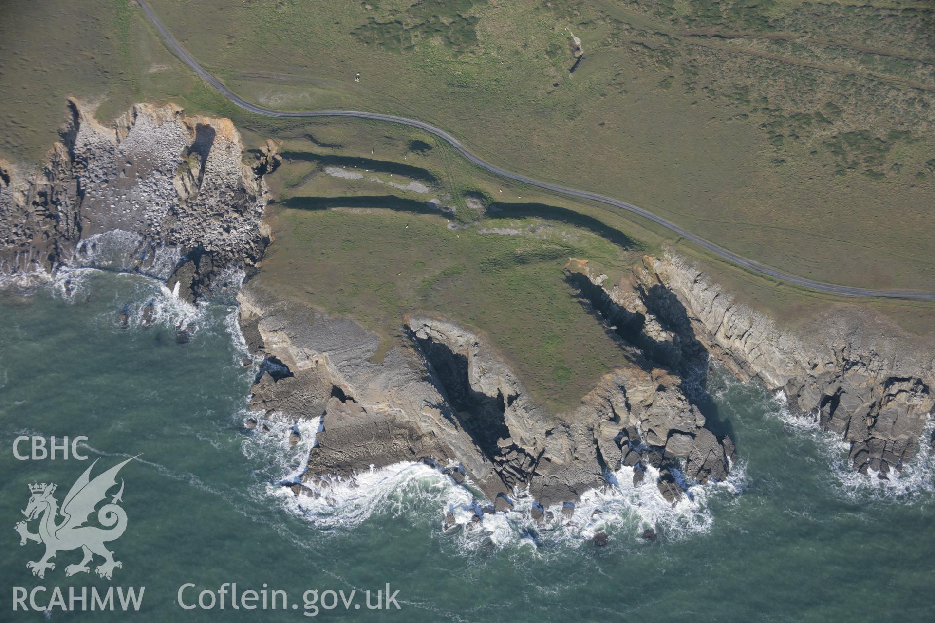 RCAHMW colour oblique aerial photograph of promontory fort at Linney Head Camp, Castlemartin, viewed from the south Taken on 19 November 2005 by Toby Driver