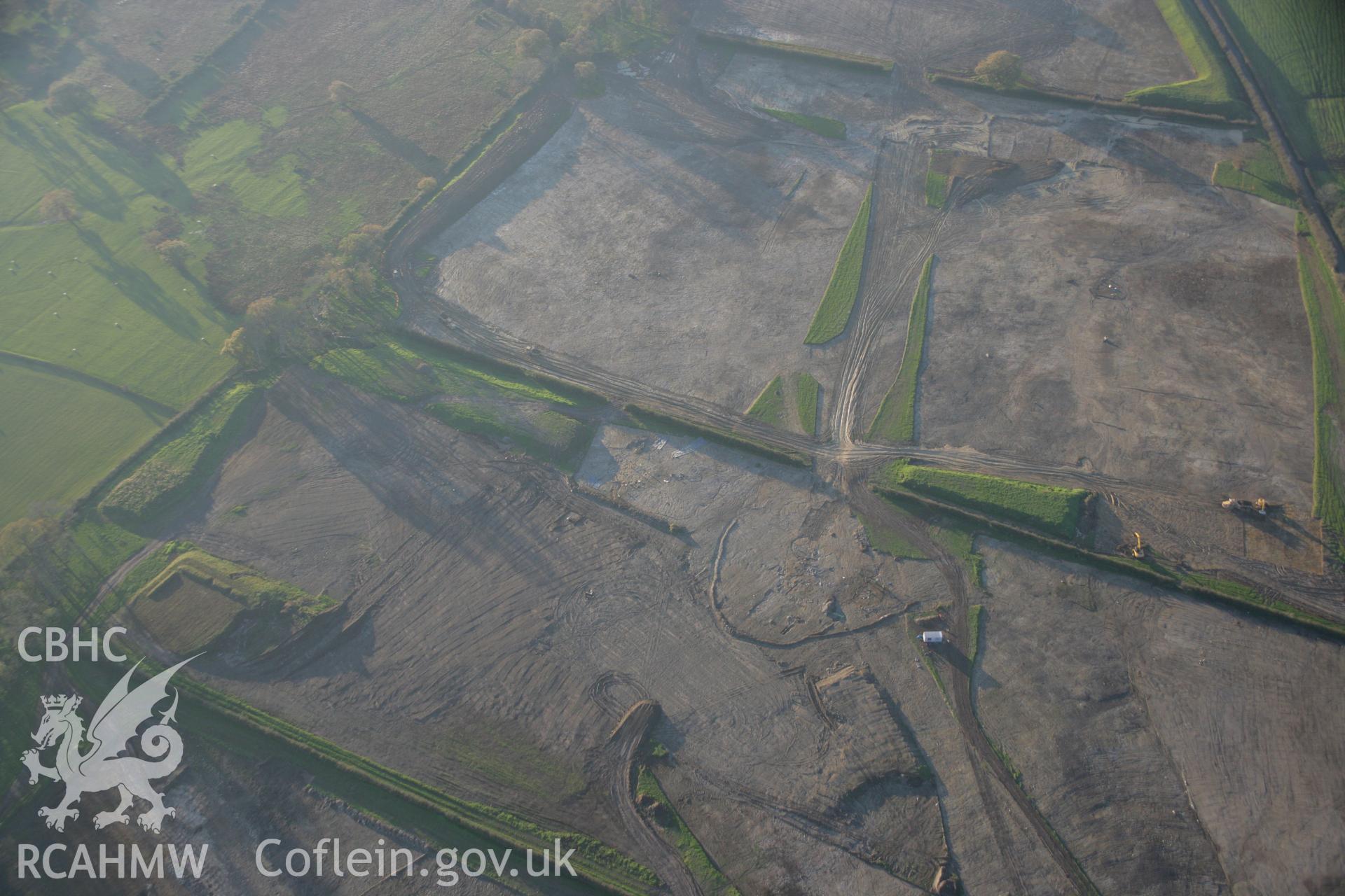 RCAHMW colour oblique aerial photograph of Parc Bryn Cegin prehistoric settlements under excavation by Gwynedd Archaeological Trust, viewed looking to the south-west. Taken on 21 November 2005 by Toby Driver