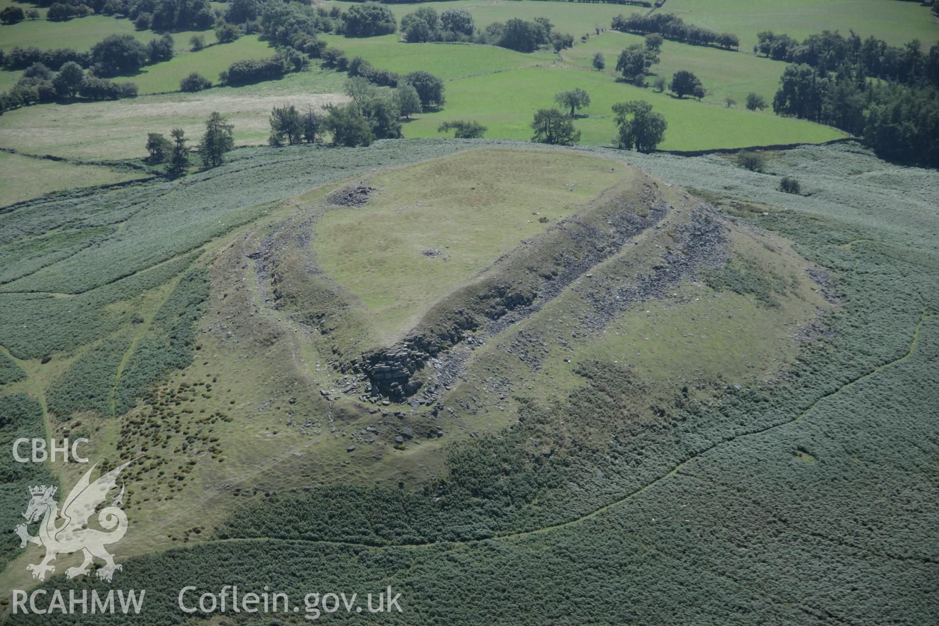 RCAHMW digital colour oblique photograph of Crug Hywel Hillfort viewed from the north-west. Taken on 02/09/2005 by T.G. Driver.