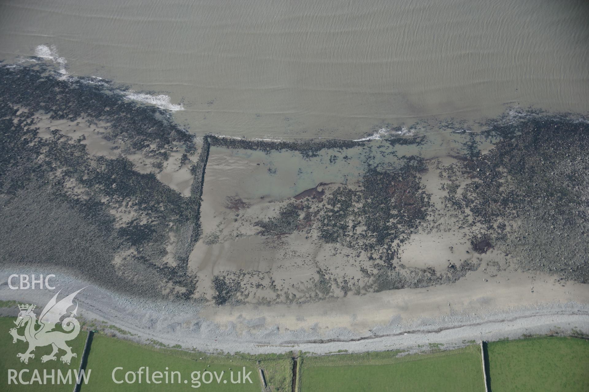 RCAHMW colour oblique aerial photograph of Llwyngwril Fish Trap I, viewed from the east. Taken on 17 October 2005 by Toby Driver