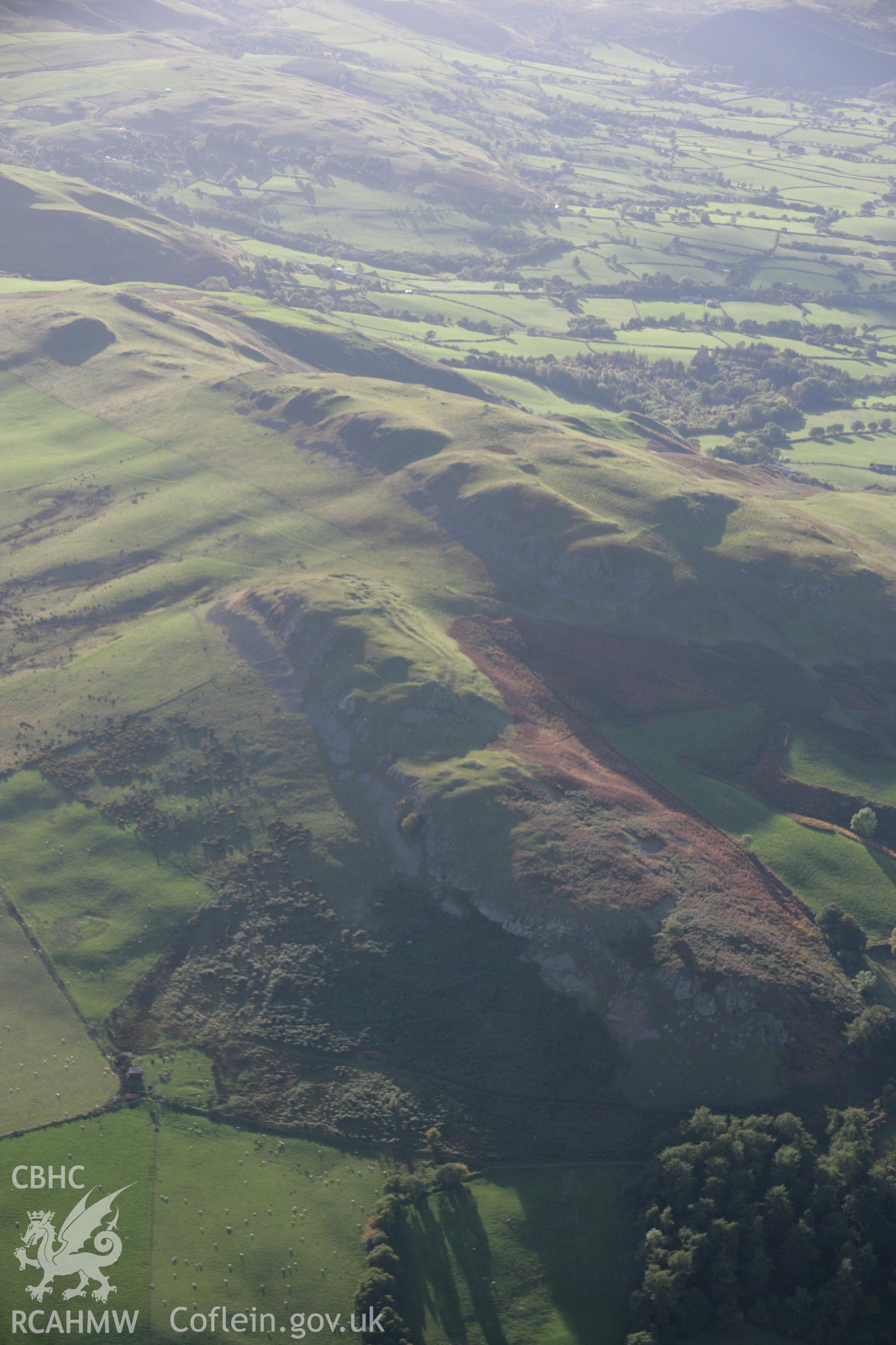 RCAHMW colour oblique aerial photograph of Llandegley Rocks Enclosure showing hillfort. Taken on 13 October 2005 by Toby Driver