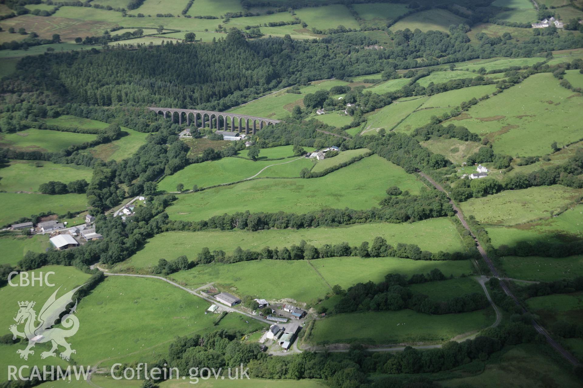 RCAHMW colour oblique aerial photograph of Cynghordy Railway Viaduct. A long view from the east showing it in its landscape. Taken on 02 September 2005 by Toby Driver