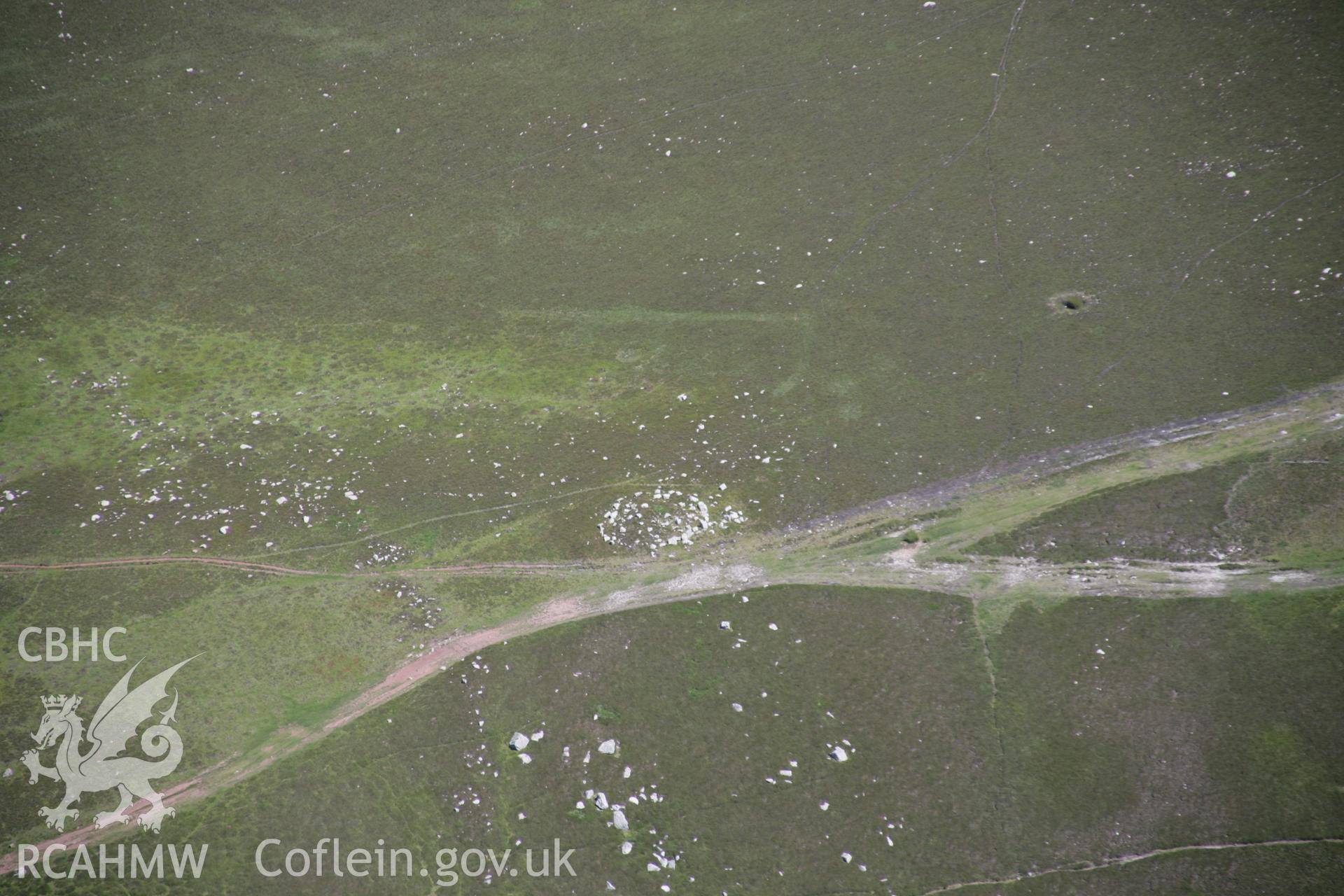 RCAHMW colour oblique aerial photograph of Rhossili Down Cairn II, viewed from the west. Taken on 22 June 2005 by Toby Driver