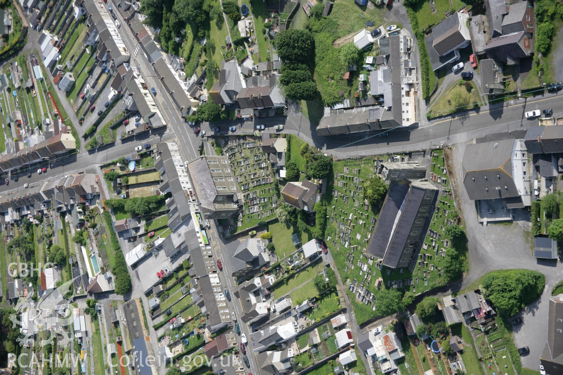RCAHMW colour oblique aerial photograph of Llangennech in general view of the town from the north, with St Cennech's Church. Taken on 09 June 2005 by Toby Driver