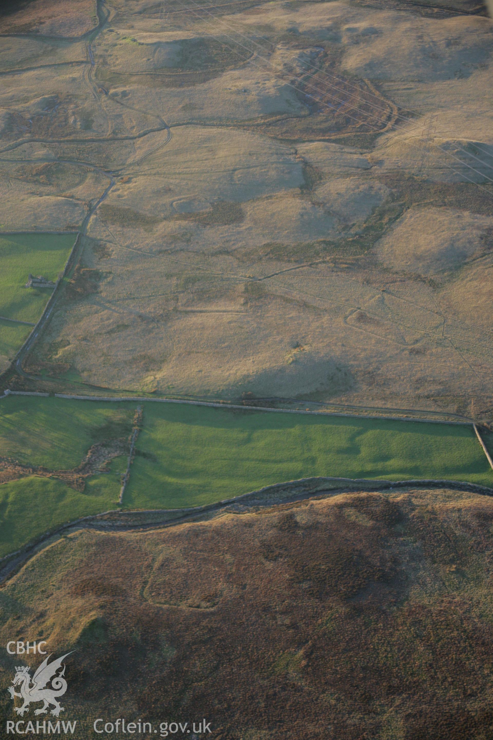 RCAHMW colour oblique aerial photograph of Roman practice camps, Dolddinas I, III, IV and V viewed from the south-east. Taken on 21 November 2005 by Toby Driver