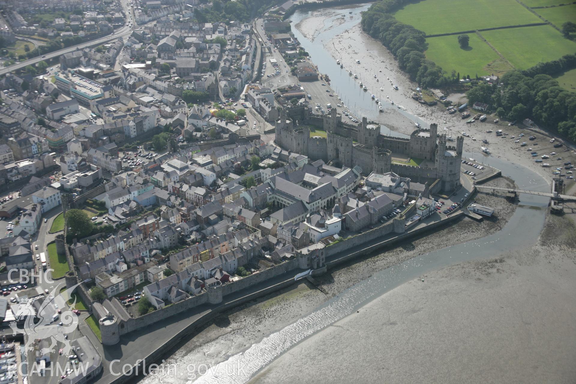 RCAHMW digital colour oblique photograph of Caernarfon Castle viewed from the north. Taken on 27/07/2005 by T.G. Driver.