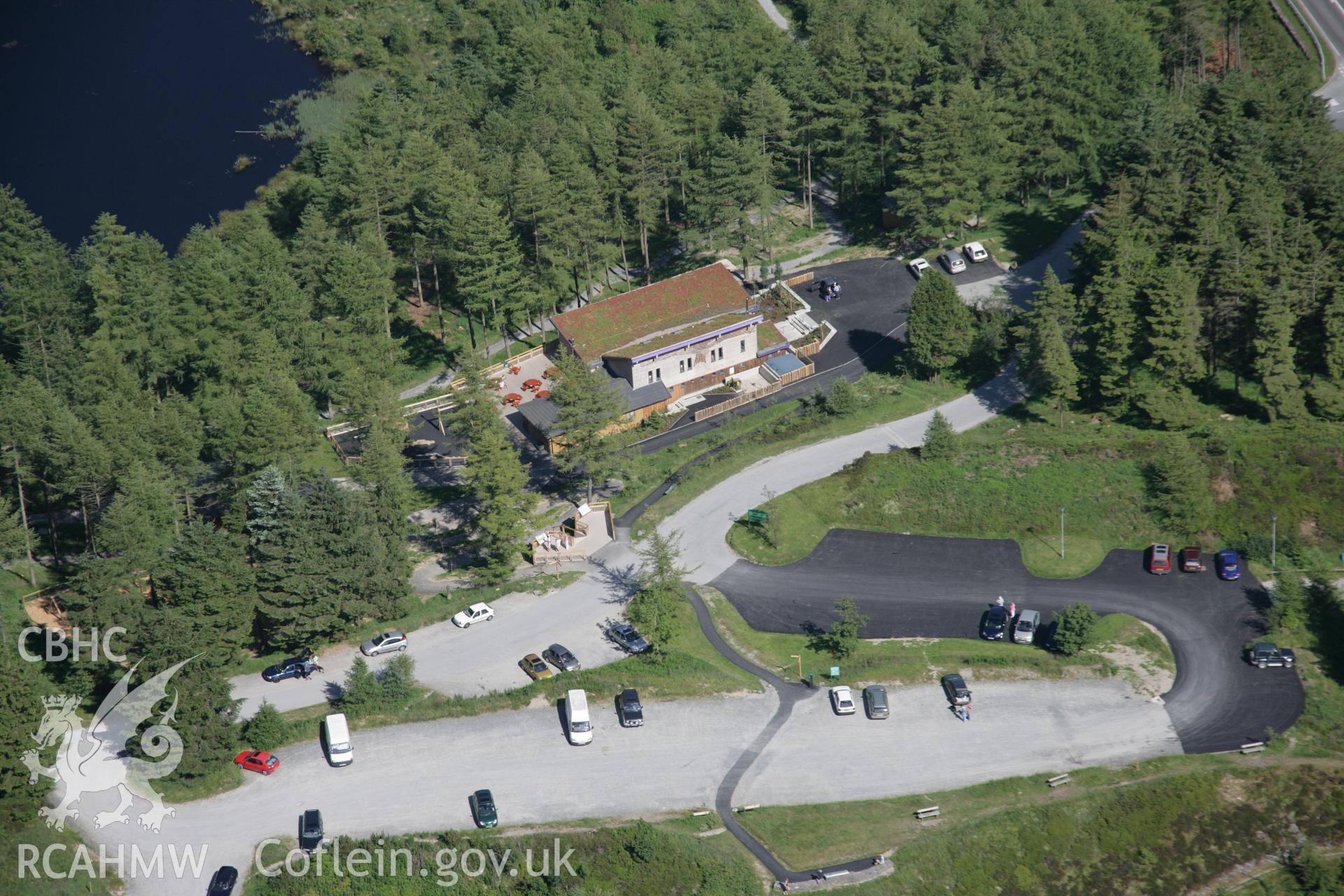 RCAHMW colour oblique aerial photograph of Bwlch Nant-yr-Arian Forest Visitor Centre from the west. Taken on 23 June 2005 by Toby Driver