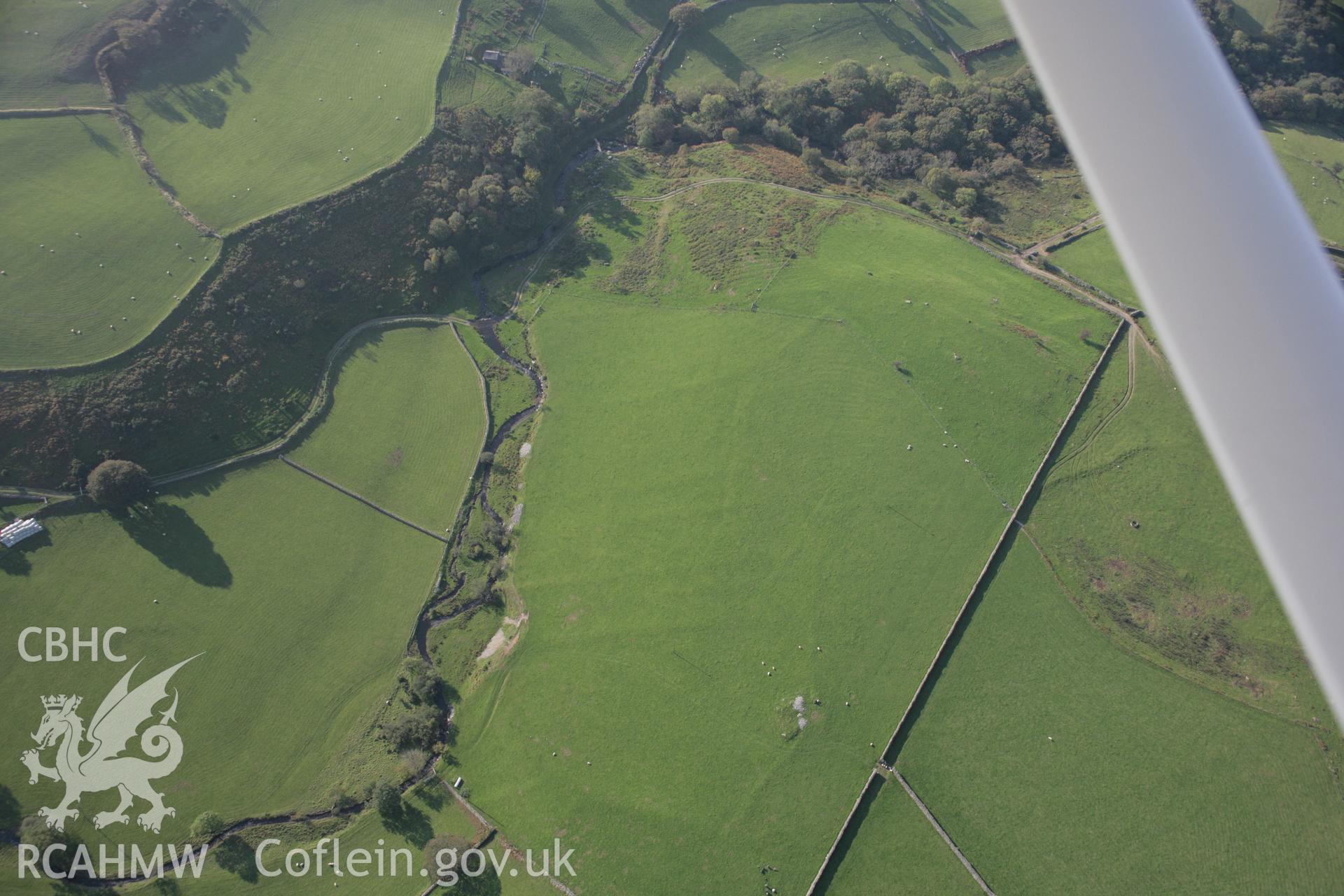 RCAHMW colour oblique aerial photograph of Llys Bradwen,  medieval settlement, viewed looking to the west. Taken on 17 October 2005 by Toby Driver