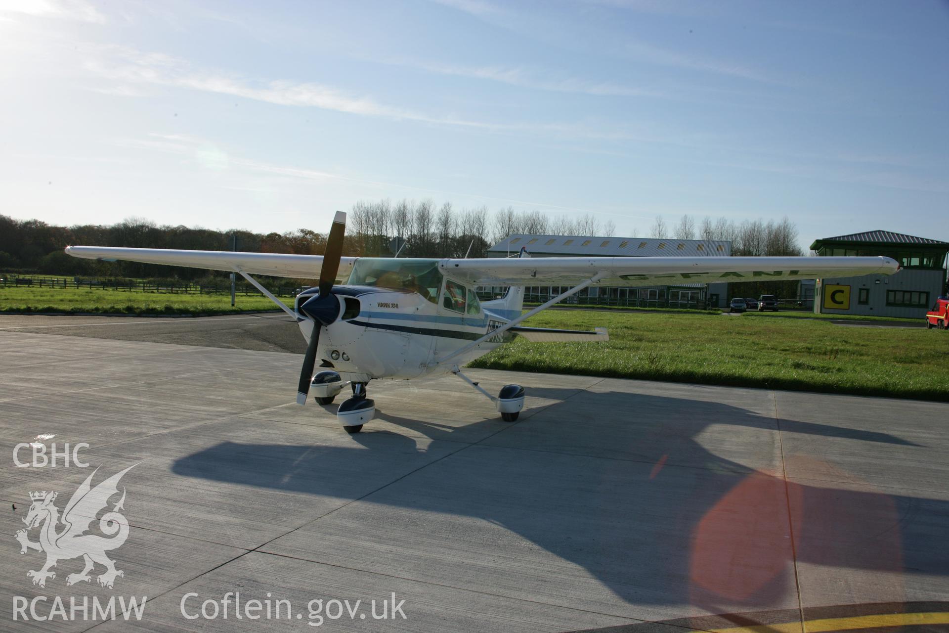 RCAHMW colour photograph of Cessna 172, used for reconnaissance, pictured on apron to east of main buildings, at Haverfordwest Airfield (Withybush). Taken on 19 November 2005 by Toby Driver