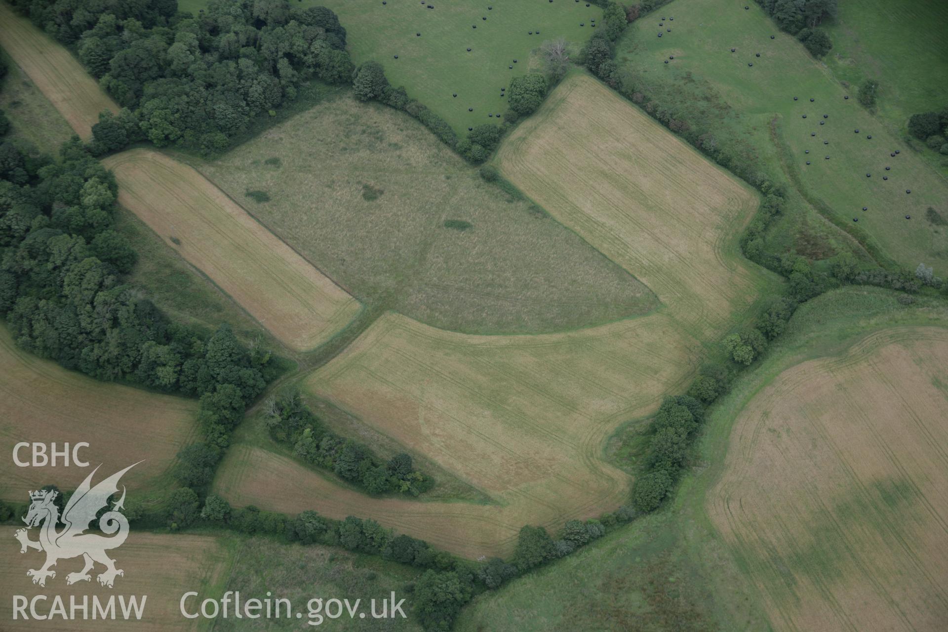RCAHMW digital colour oblique photograph of the Viking settlement at Glyn, Llanbedrgoch viewed from the south-east. Taken on 02/08/2005 by T.G. Driver.