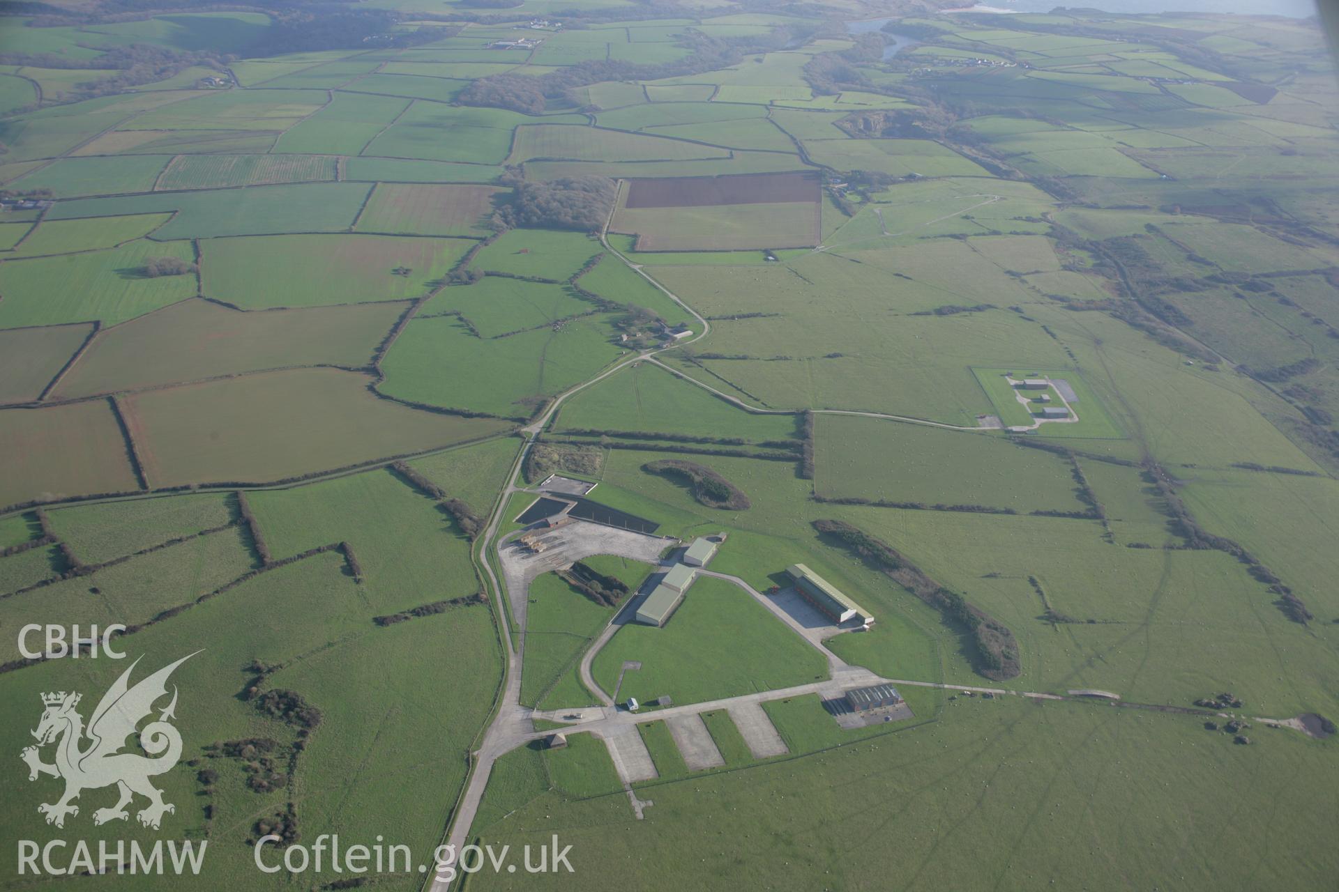 RCAHMW colour oblique aerial photograph of Castlemartin Training Area, showing a modern military installation near Trenorgan, looking east. Taken on 19 November 2005 by Toby Driver