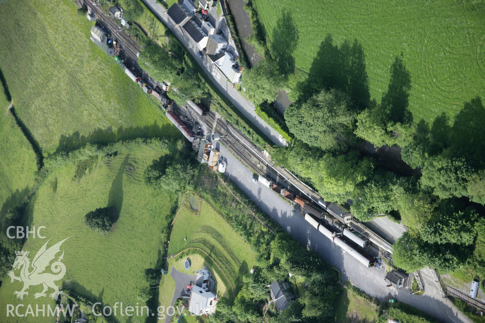 RCAHMW colour oblique aerial photograph of Bronwydd Arms Railway Station, Carmarthen and Cardigan Railway, from the south. Taken on 09 June 2005 by Toby Driver