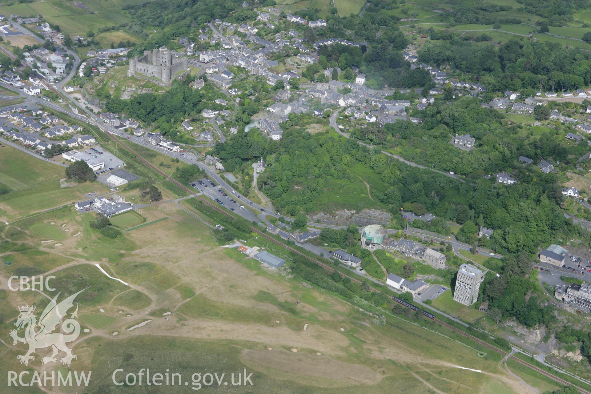 RCAHMW colour oblique photograph of Harlech Castle and town. Taken by Toby Driver on 13/06/2008.