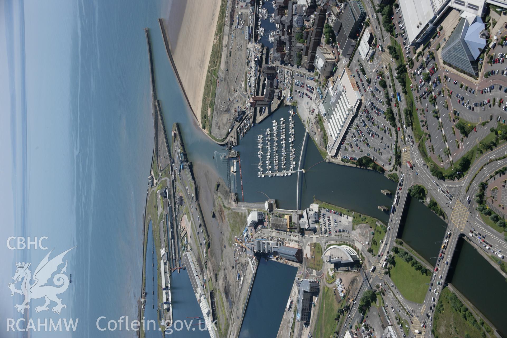 RCAHMW colour oblique aerial photograph of Swansea Docks. A landscape view from the north. Taken on 22 June 2005 by Toby Driver