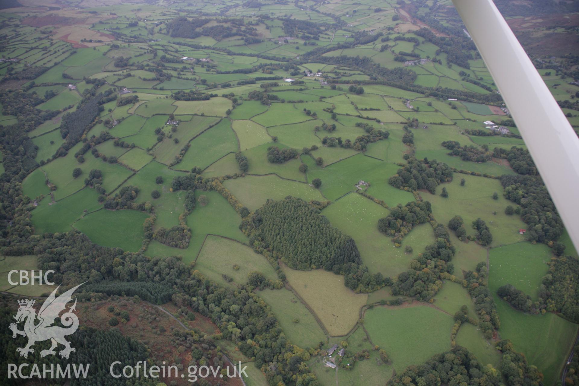 RCAHMW colour oblique aerial photograph of Hafodygarreg. A wide view of its hinterland from the south-east. Taken on 13 October 2005 by Toby Driver