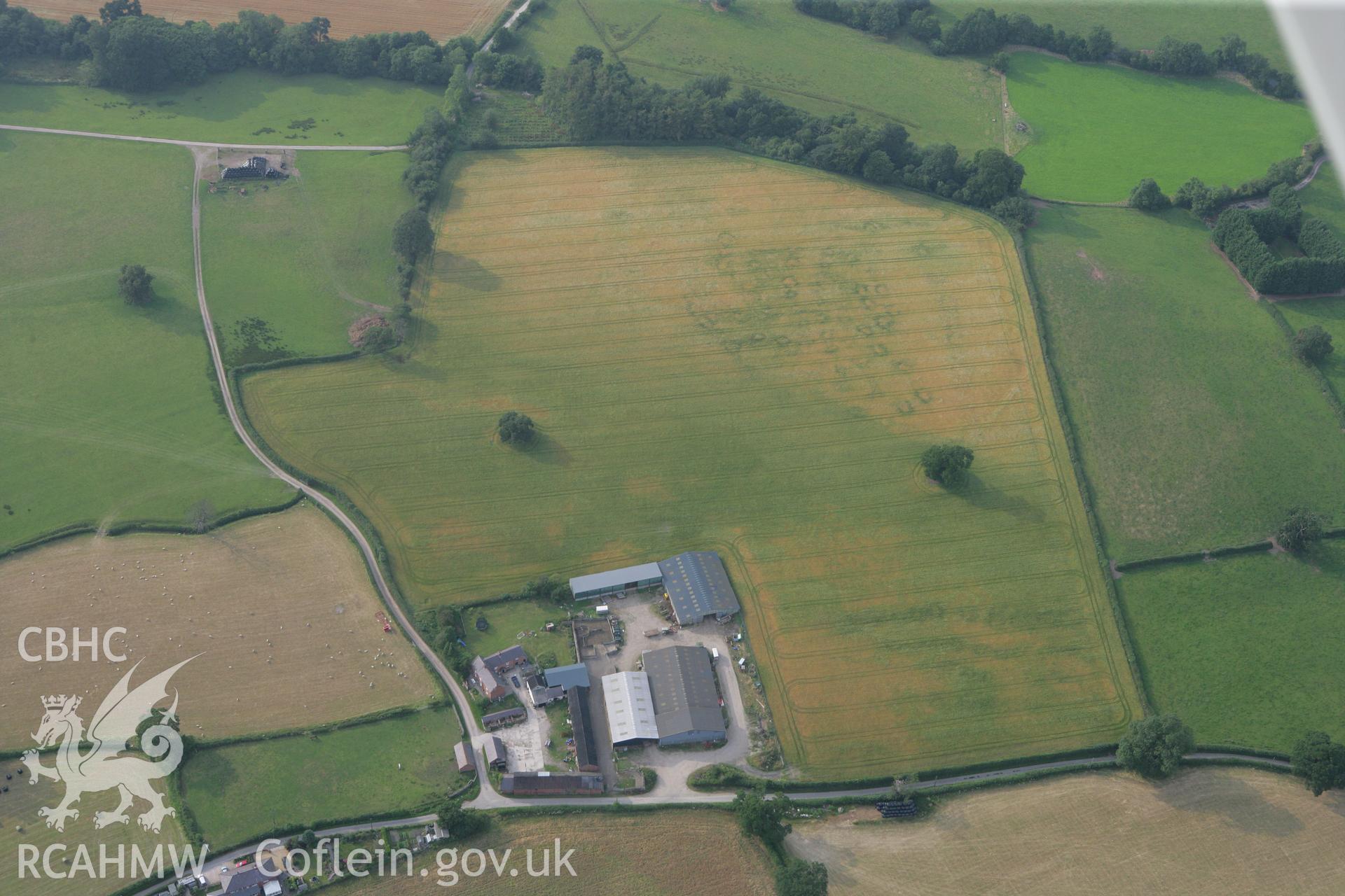 RCAHMW colour oblique photograph of cropmarks north of Glan Clwyd farm. Taken by Toby Driver on 24/07/2008.